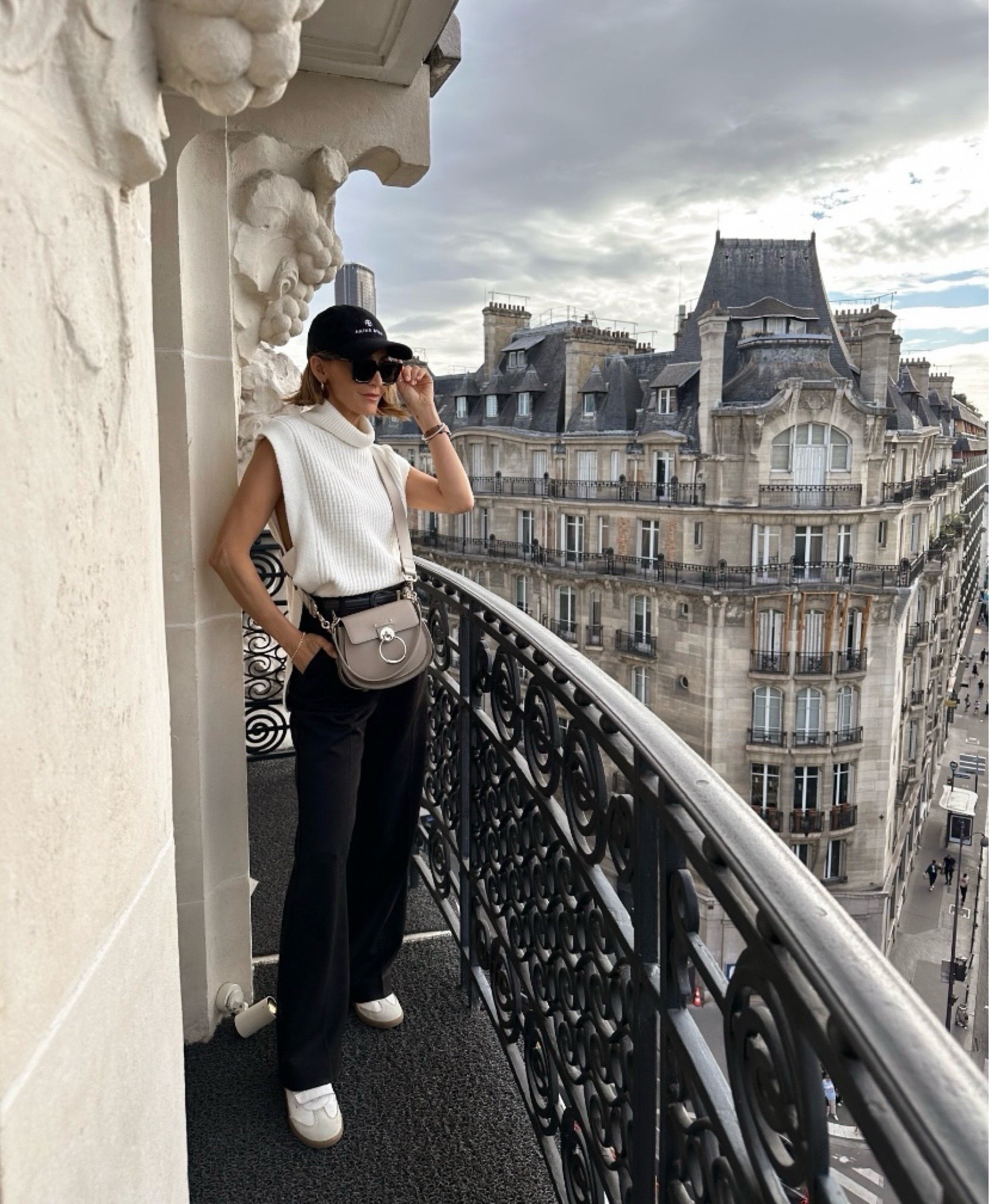 This is such a comfortable and practical travel outfit, whether you’re on a Euro trip or you’re traveling in the states. These trousers were highly popular last fall, and they come in classic black as well as tan. Layer on a cozy sweater vest for a preppy look — you could also add a thicker coat if you’re cold!