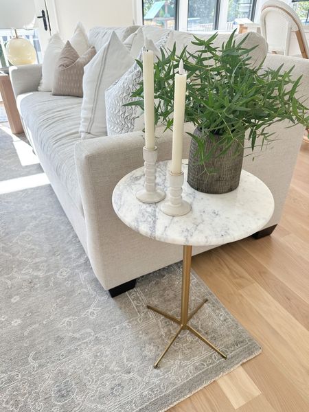Marble and brass side table, neutral bench seat sofa, York sofa pottery barn in Performance Heathered Tweed in Pebble. Neutral gray rug, neutral home, McGee and Co tapered candle holders 

#LTKhome #LTKstyletip #LTKsalealert