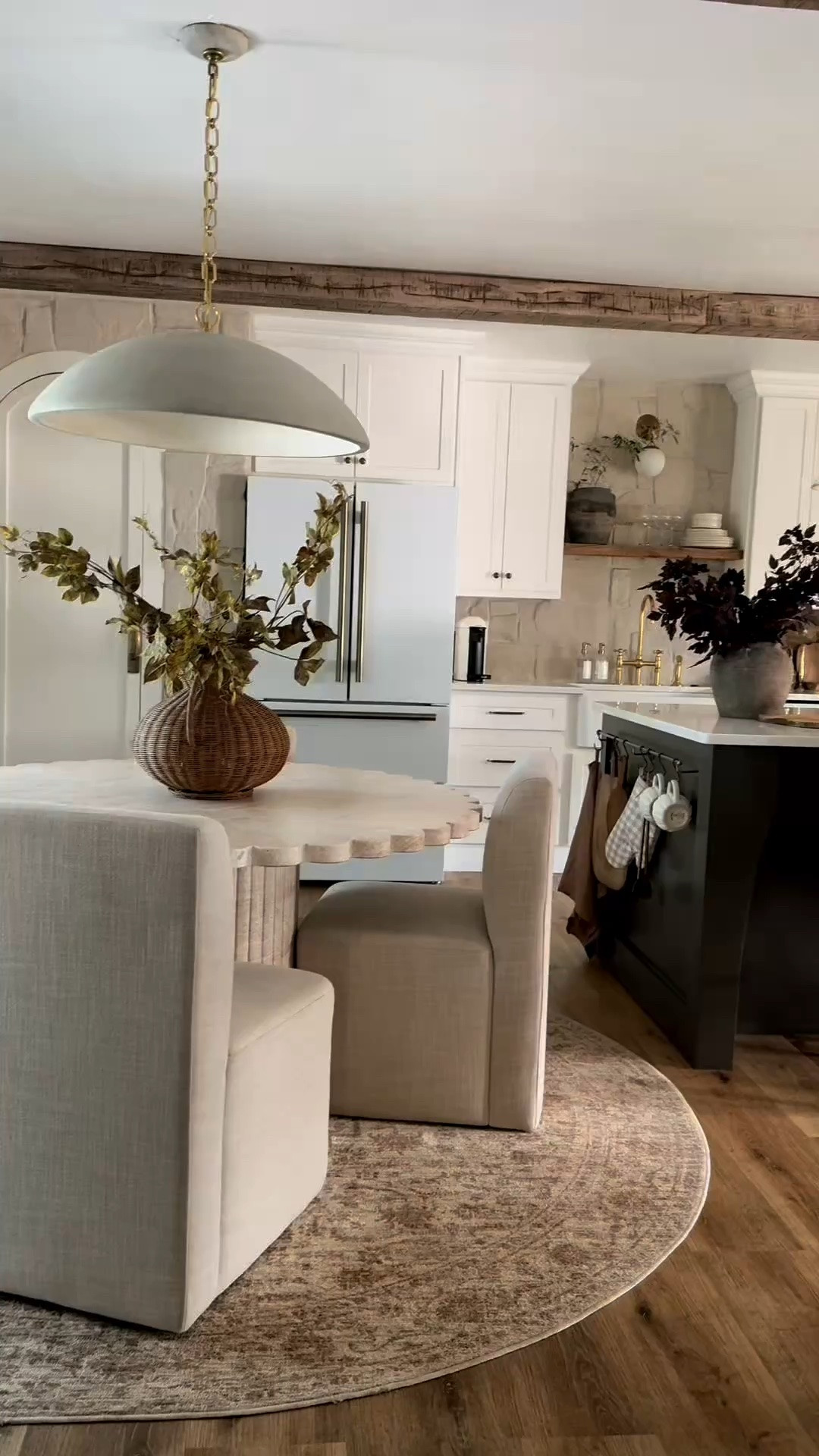 Cozy collected kitchen for the fall season. This is last year and I currently have different dining chairs but I couldn’t recommend these enough. I’ve even taken them outside and presser washed them and they came clean and it didn’t hurt the fabric! I linked very similar grape ivy stems from Amazon that I bought this year and haven’t shared yet but they are super similar to my afloral version and a lot less expensive! Brass in a kitchen really warms up a space! My stone is sandstone Alamo random ledger panel from floor and decor. Barstools are Taino counter stools from OKA.

#LTKHome #LTKSeasonal