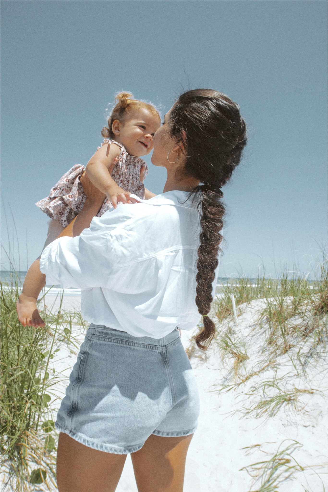 Here's a revised caption for LTK that's less cringey and bubbly:

Spending quality time with my little one at the beach, enjoying the sun, sand, and sea. Our matching braids are the perfect touch for our summer fashion 🥹 #momanddaughter #beachday #summerstyle #braidedhair #momfashion #ltkfamily"

#LTKSeasonal #LTKkids #LTKunder50