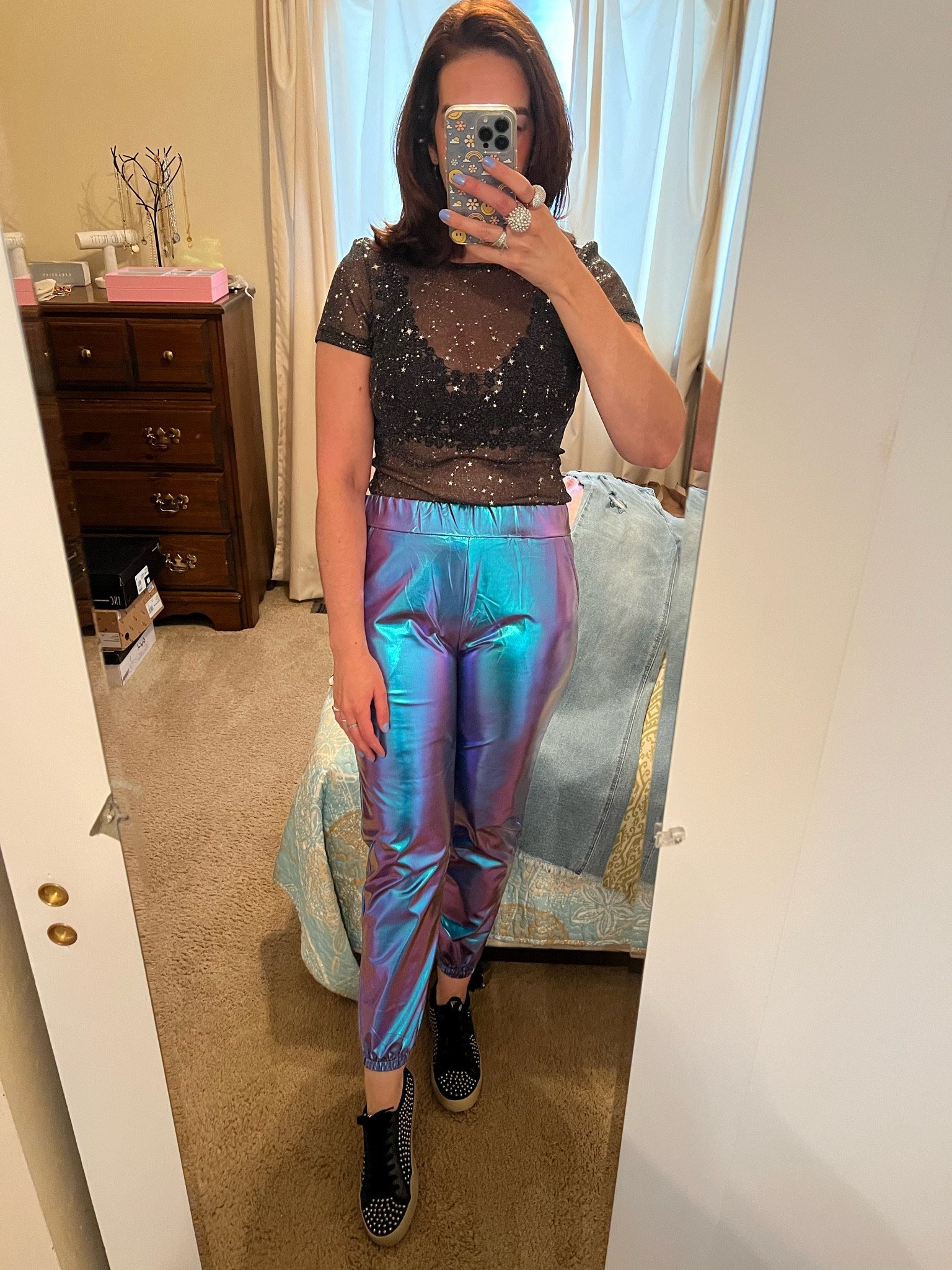 Black short sleeve glitter star sheer mesh top (size small). Metallic shiny pants (size small). Black studded sneakers (size 8.5). #shortsleeve #blacktop #metallicpants #shinypants #studdedsneakers #sneakers #blacksneakers #blackbralette #bralette #concertoutfit #meshtop #startop #glittertop #tshirt 

#LTKSeasonal #LTKFindsUnder100 #LTKStyleTip