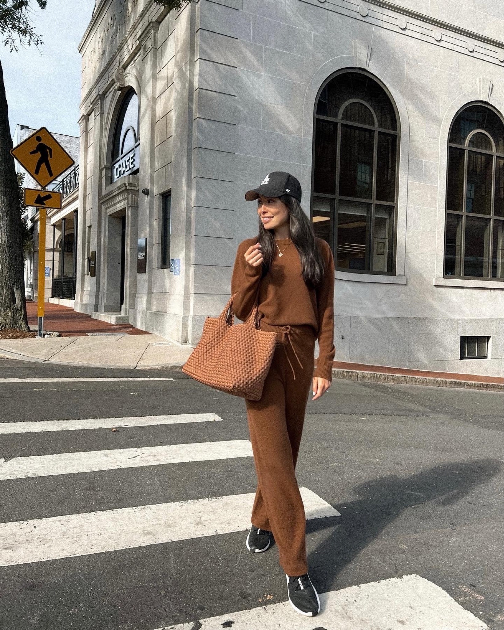 Kat Jamieson of With Love From Kat wears a fall outfit. Neutral style, brown sweater, brown sweatpants, black sneakers, brown tote bag, black hat, gold necklace. 

#LTKSeasonal #LTKstyletip