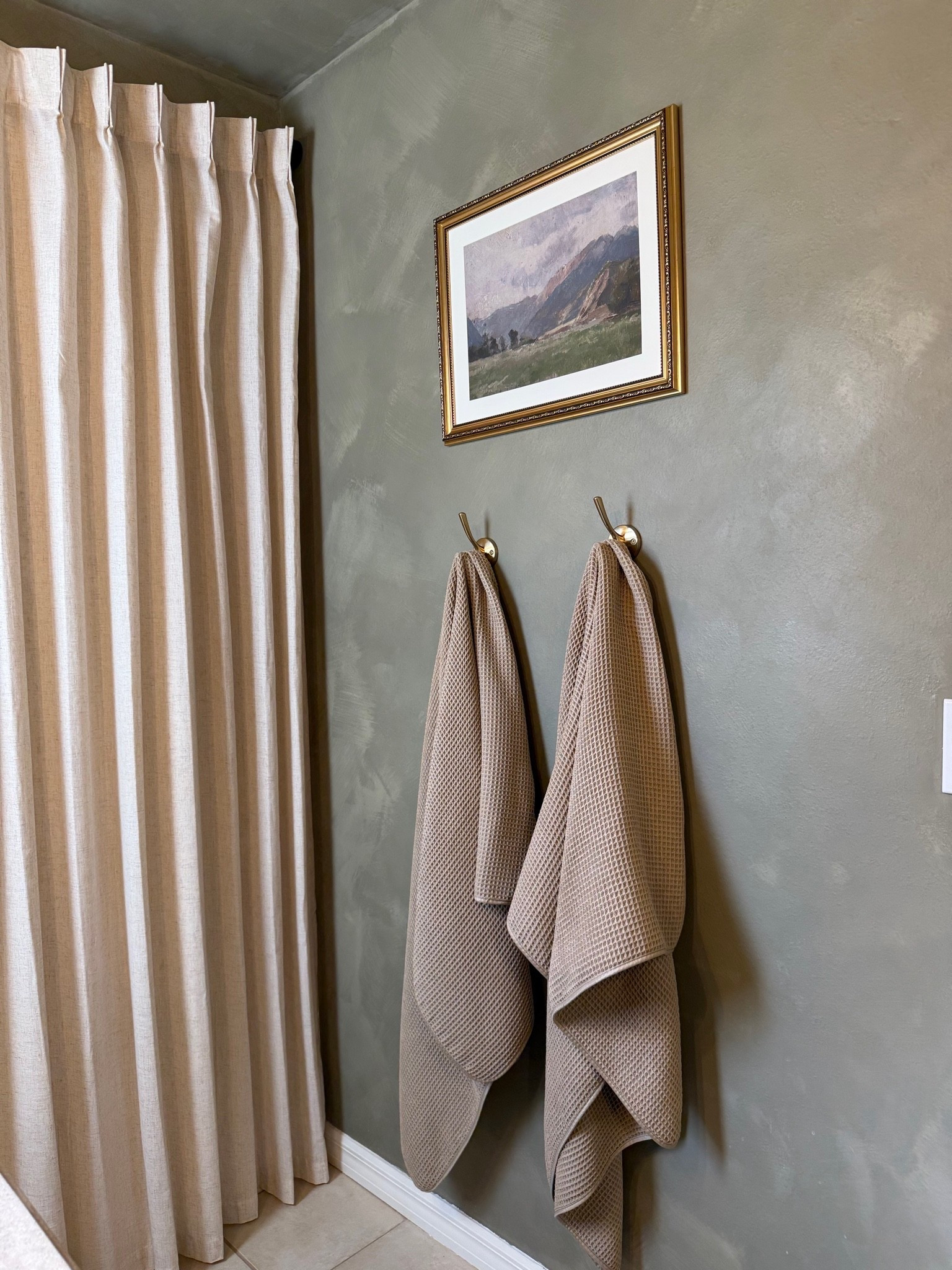 It’s the little details that make a bathroom feel finished 🤎 Warm brass hooks, textured waffle towels, vintage-inspired art + a linen-look shower curtain gave this corner so much more character without adding clutter. I wanted the bathroom to feel warm, collected and a little old-fashioned in the best way.

#LTKHome