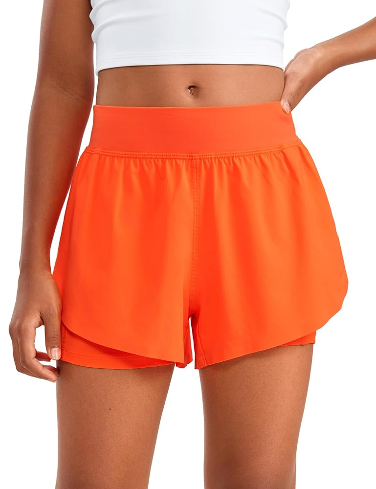 CRZ YOGA Girls 2 in 1 Dolphin Athletic Running Shorts with Pockets High Waist Teen Kid Workout Ca... | Amazon (US)