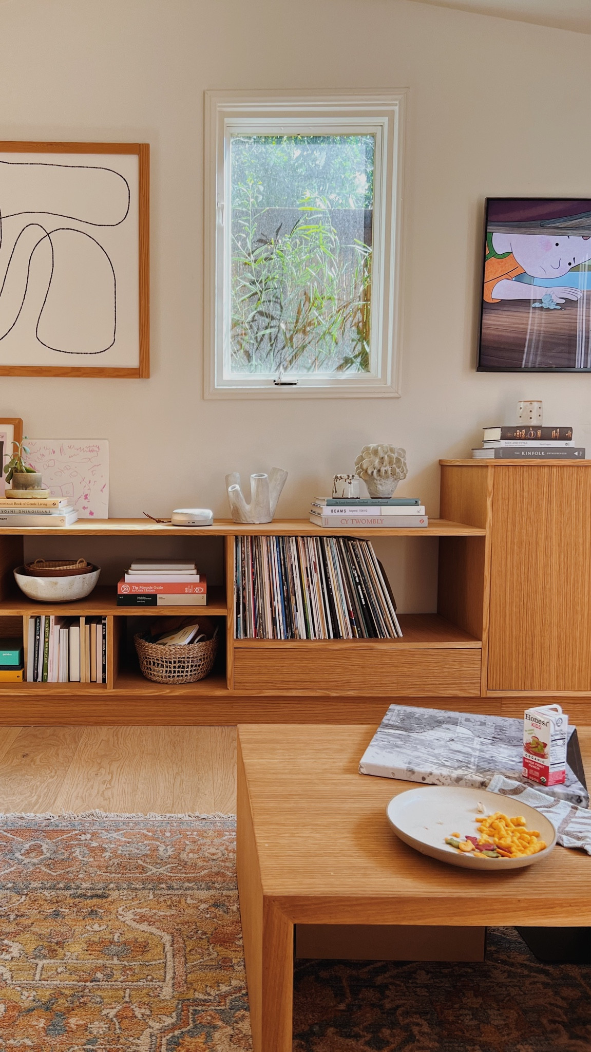 Working on restyling some of these shelves with my fave coffee table books and smaller home decor pieces. Mid century - living room - wood furniture - bookshelf - bookcase - organic modern - affordable rugs - waterfall wood coffee table

#LTKhome