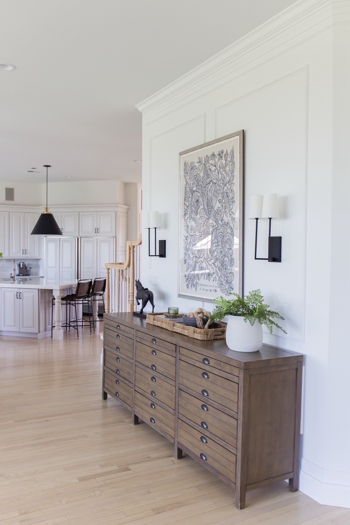 The best view of our hall going into the kitchen. This artwork is a follower favorite! #archedmanor #modernhome #neutralhome #homedecor #casualstyle #neutralstyle 

Entryway table  console table  wall art  wall sconce  modern home finds  kitchen  TheArchedManor  

#LTKSeasonal #LTKHome #LTKautumn