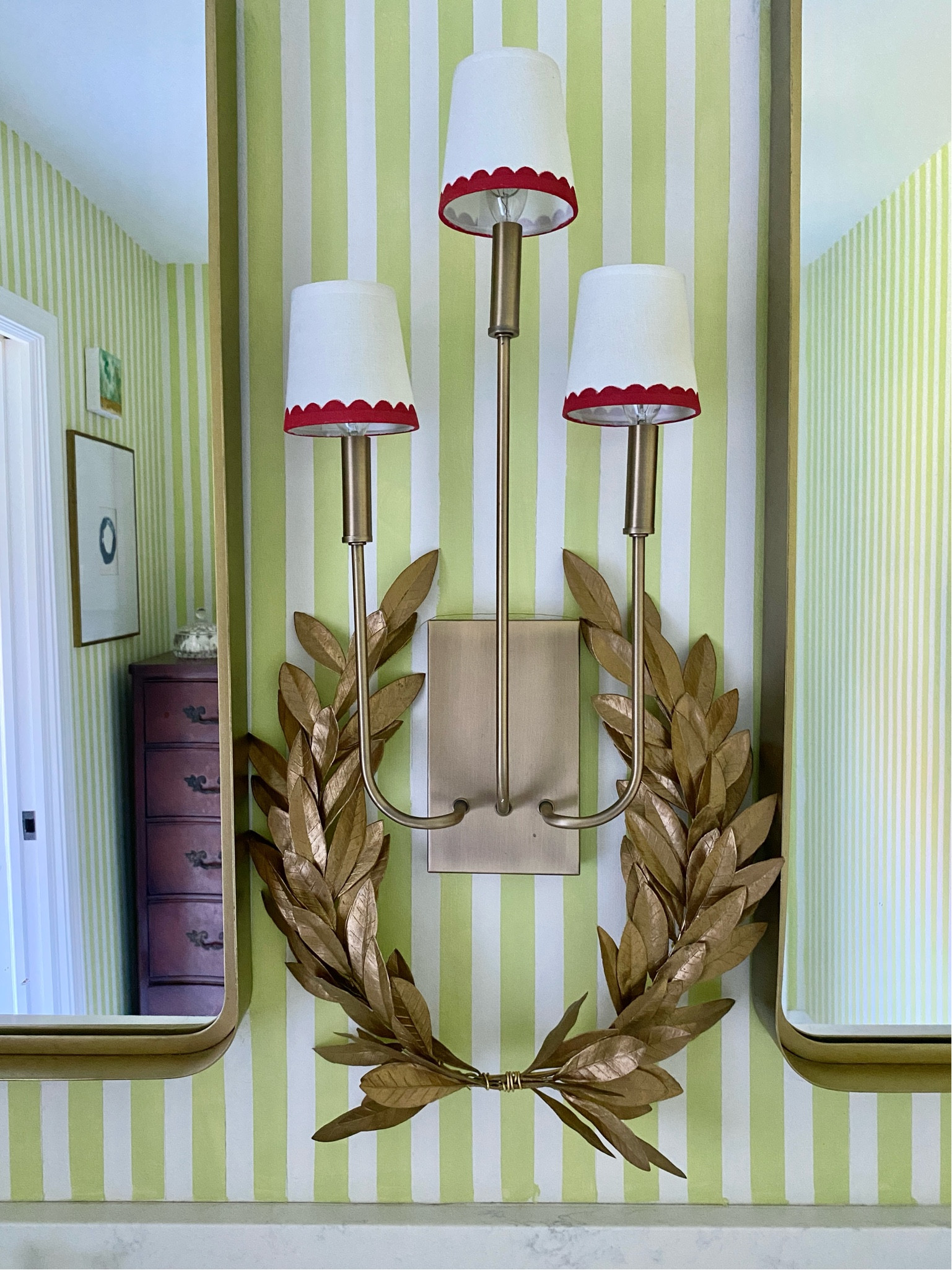 Gold laurel wreath on light fixture. Christmas decorations, decorating.

#LTKHome #LTKGiftGuide #LTKHoliday