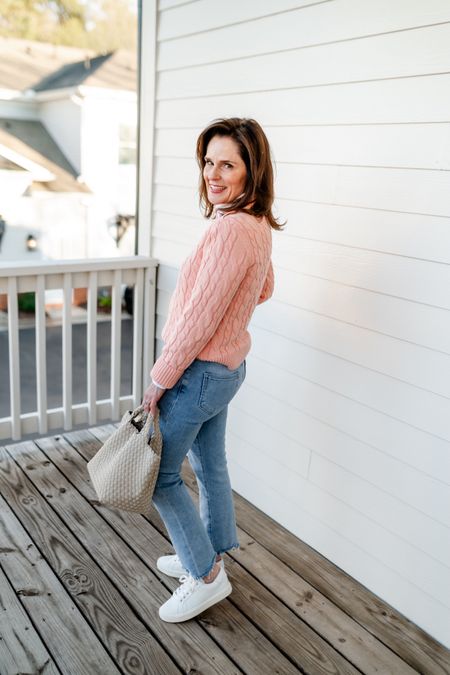 Spring essentials for petite.  Cute cotton cable knit sweater I. Peach from lands ends.  A perfect petite  white button down shirt from Talbots.  Light wash jeans that are petite firendly and look great from the back side.  White sneakers and a tote.
#petite #ltkpetite

#LTKover40 #LTKSeasonal #LTKshoecrush