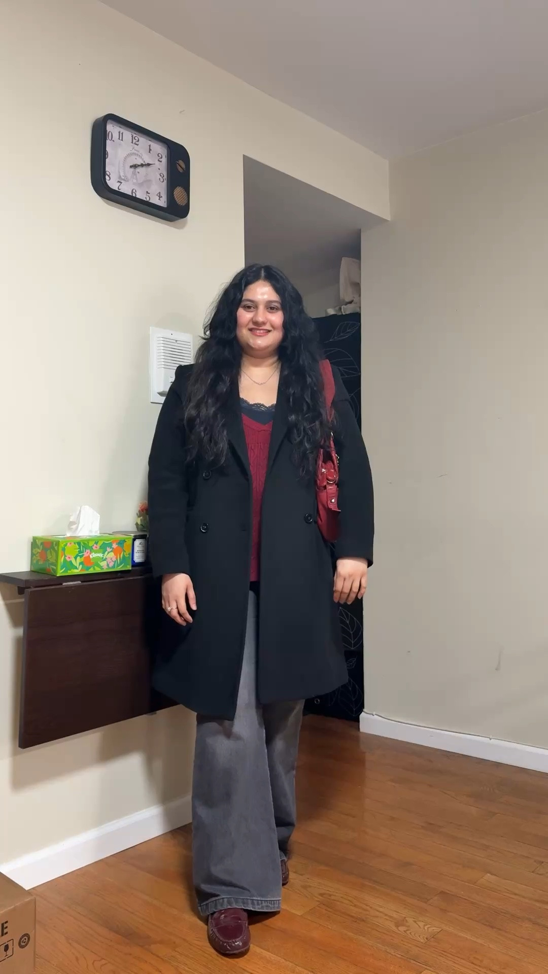 Burgundy babydoll sweater, navy lace tank top, grey bootcut jeans, black coat, red purse, and burgundy loafers 

#LTKSeasonal #LTKootd