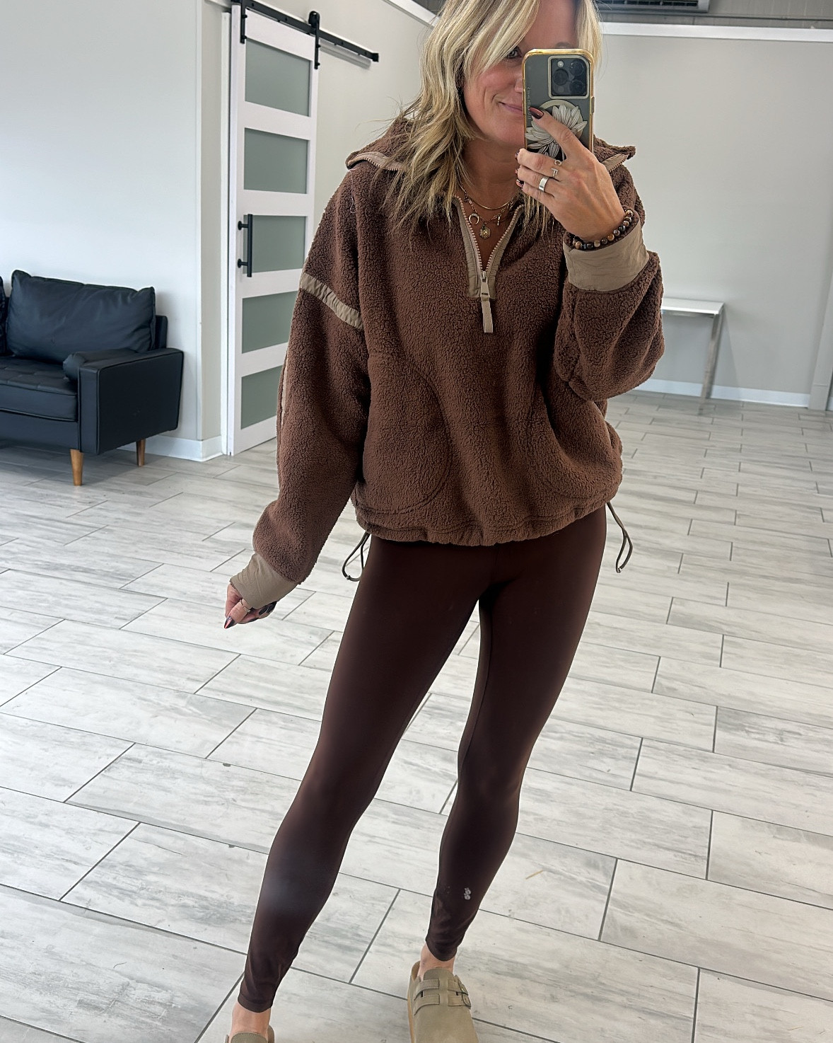 Obsessed with this entire outfit! 🤎

Top is the best lookalike— wearing a medium. Comes in other colors 

The lava brown leggings are so good — fit and feel just like aligns. Wearing a small.

Clogs- super great quality and fit TTS. Wearing an 8

These sunglasses are so good! Aviator style that don’t tangle in your hair! Innovative tangle free style. 

#LTKOver40 #LTKShoeCrush