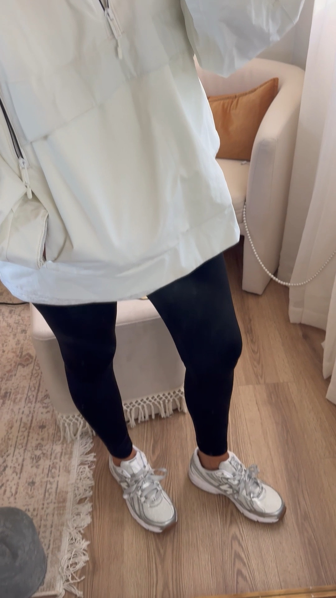 White raincoat
New balance lace sneakers