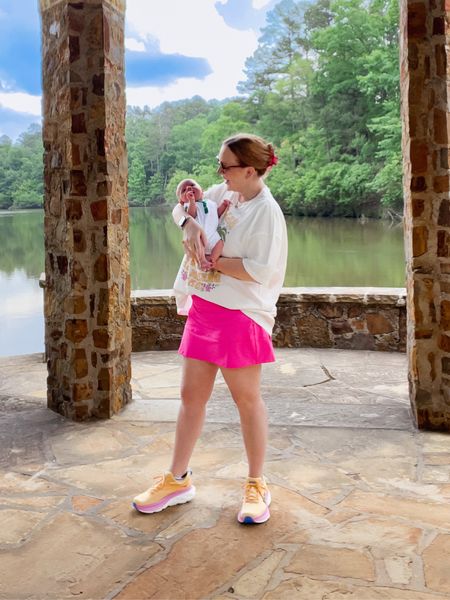 Postpartum outfit / hot pink skirt / lululemon dupe / tennis skirt / golf skirt / hoka / graphic tee / oversized tee / athleisure 

#LTKfamily #LTKkids #LTKunder50