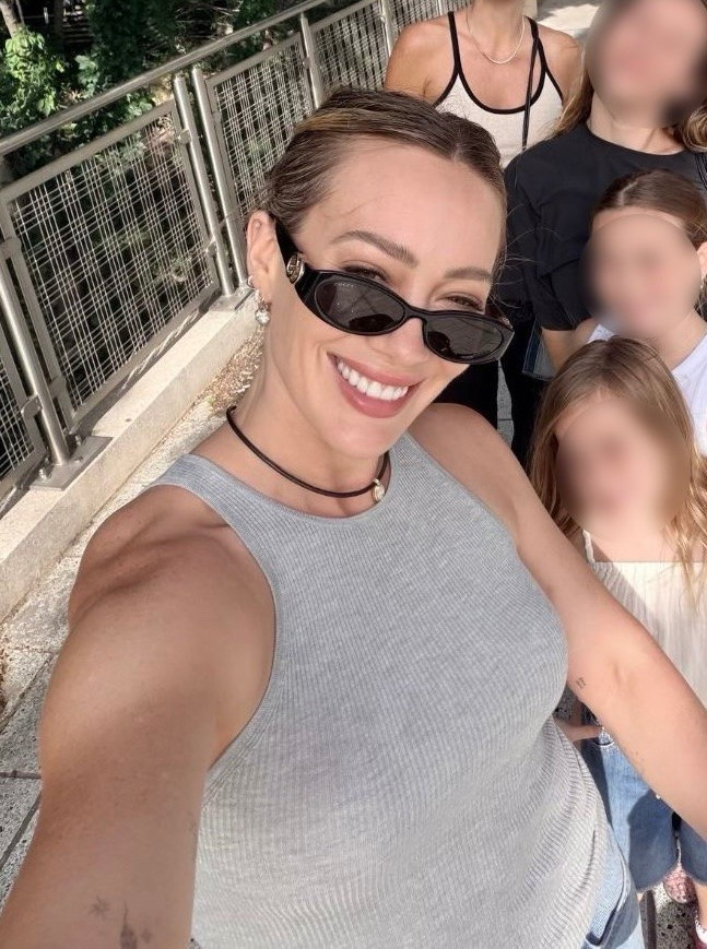 Hilary Duff via Instagram on July 1, 2026. Hilary Duff wears heather grey tank, yellow gold watch by Cartier and black sunglasses