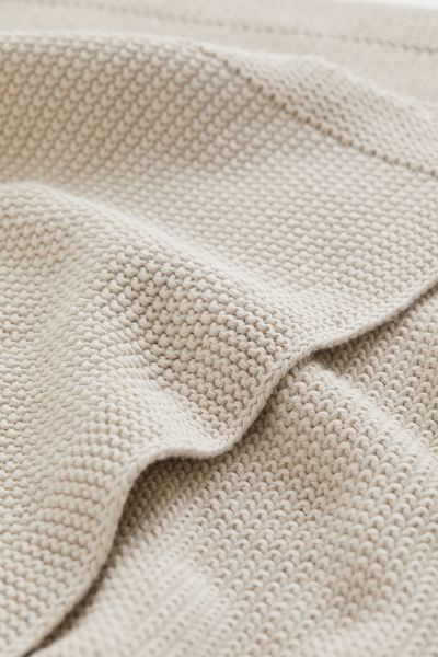 Conscious choice  BabyMoss-stitched blanket in soft, organic cotton – a perfect gift. This comf... | H&M (US + CA)