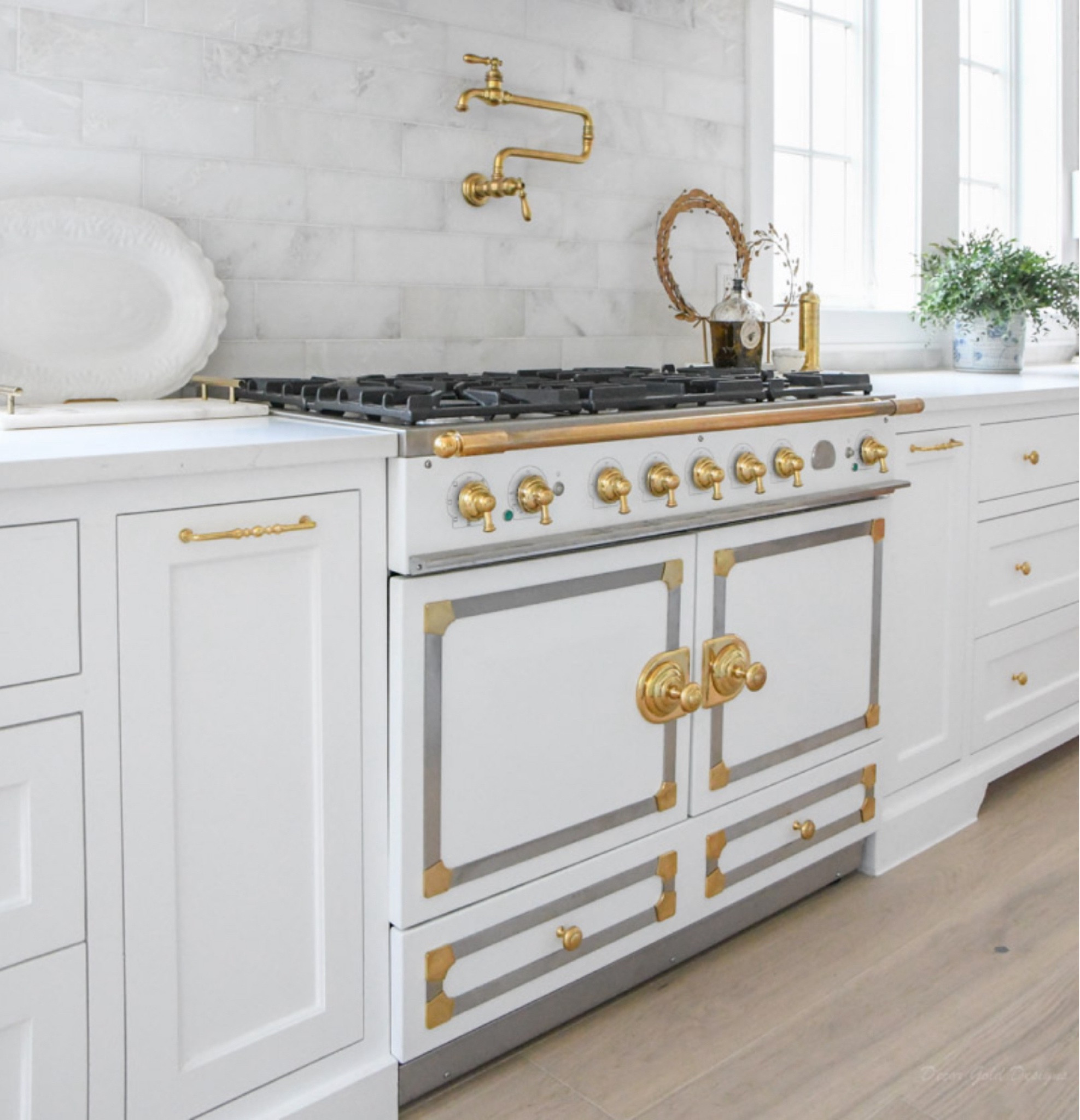 Gorgeous kitchen range in white, brass, and stainless! 

#LTKhome