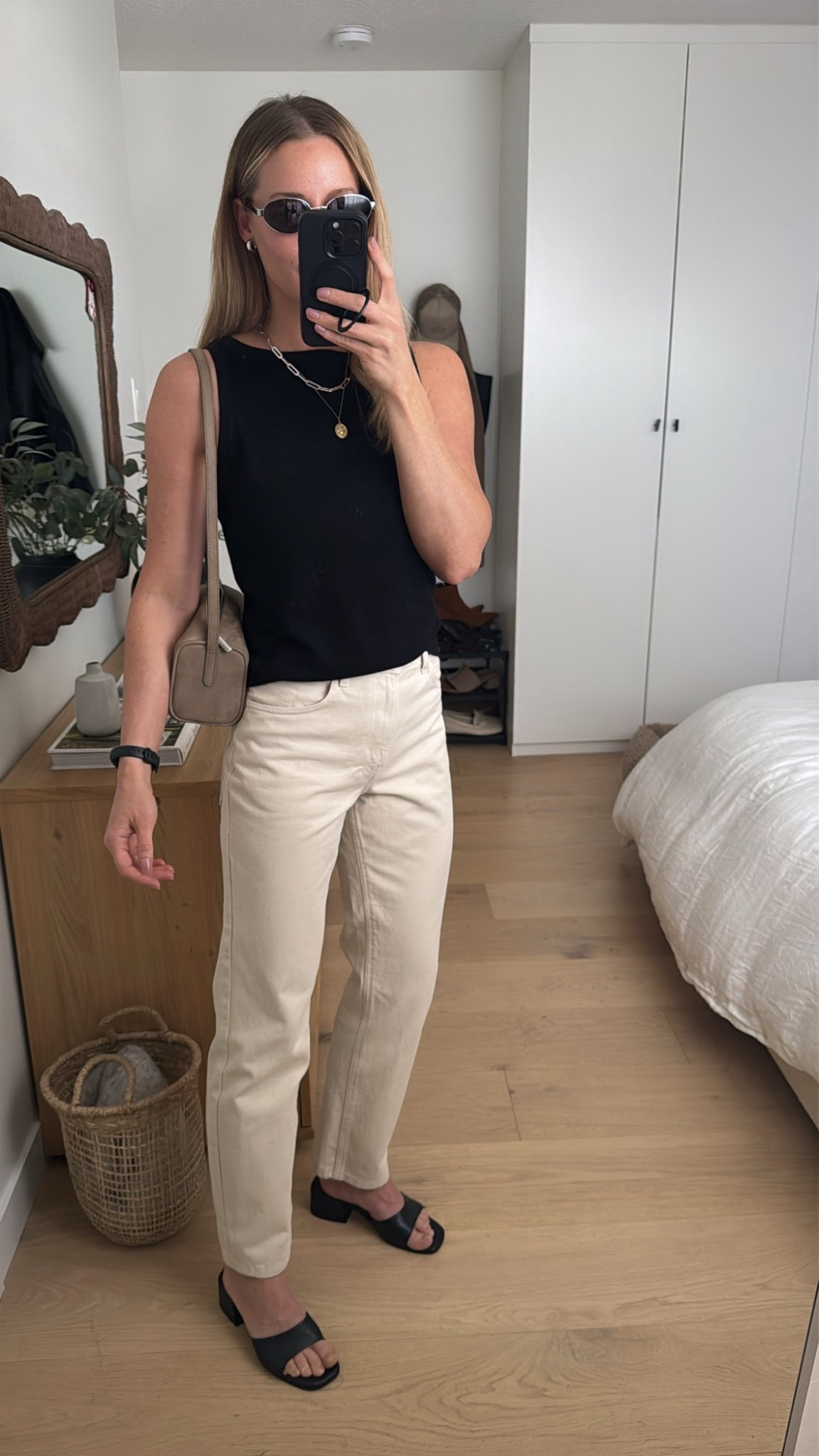 90s minimalist inspired spring outfit. This vest top is so perfect, light airy, soft and elevated (runs big size down 1), I had the jeans tailored to slim the legs (also recommend sizing down in these 1-2 sizes). Wearing Poppy Barley sandals (old) and Annex bag! 

#LTKOver40 #LTKootd #LTKSeasonal