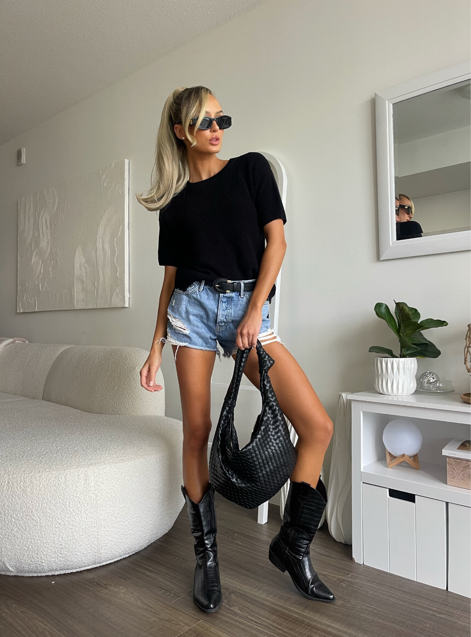 Model off duty look! Jean shorts black boots woven shoulder bag, day time casual, elevated basic, fall sweater, Florida fall outfits 

#LTKfindsunder50 #LTKU #LTKfindsunder100