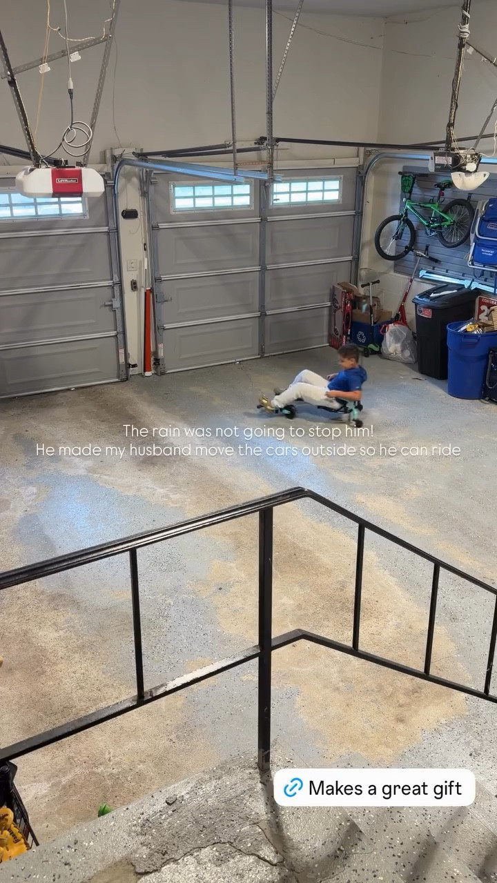 The rain was not going to stop him! 
He made my husband move the cars outside so he can ride