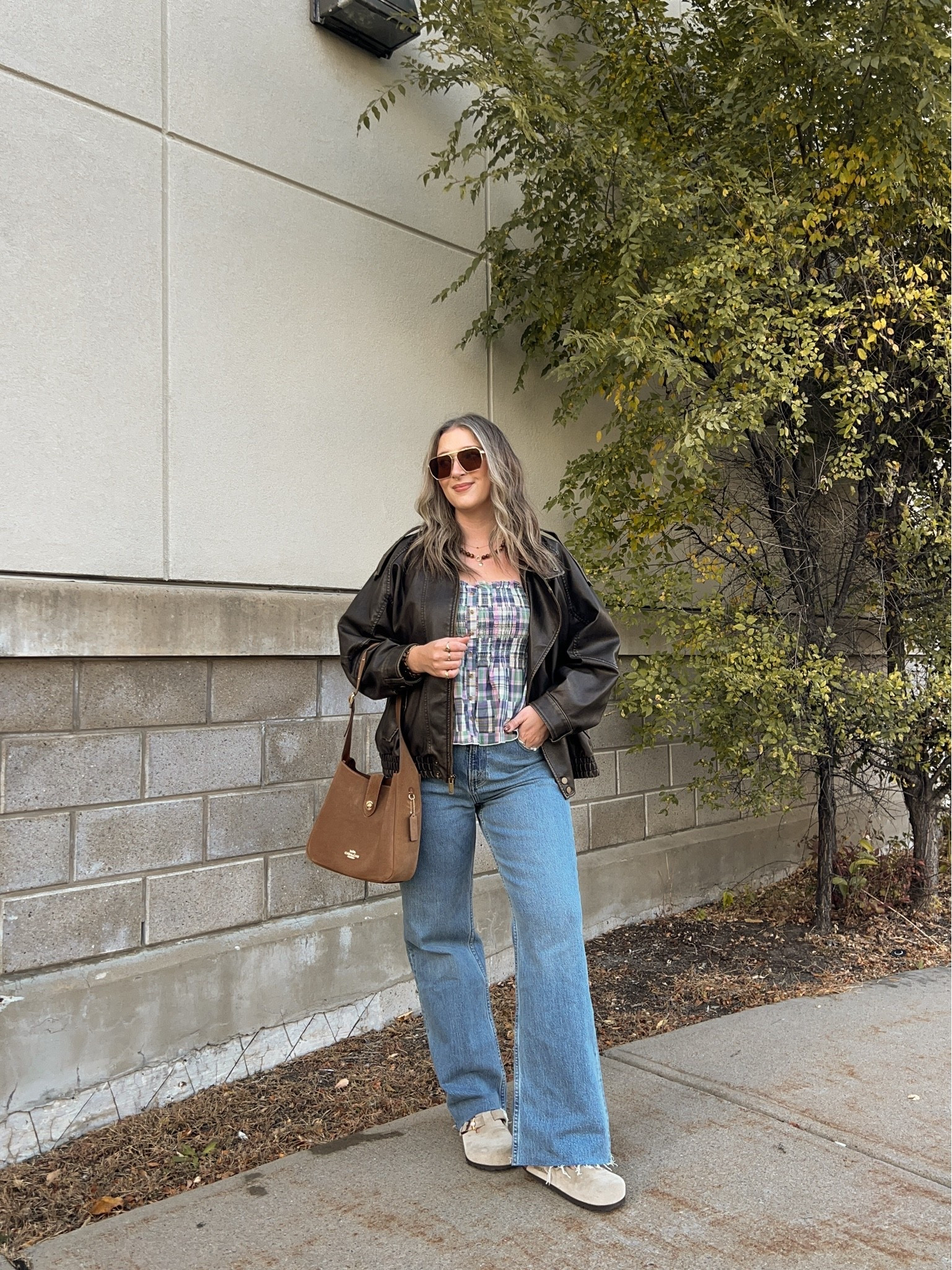 Casual fall outfit! Wearing L in the leather jacket and plaid tank top. Wearing size 30 in the jeans. I’m a 9.5-10 shoe and wear a 40 in the Birkenstocks