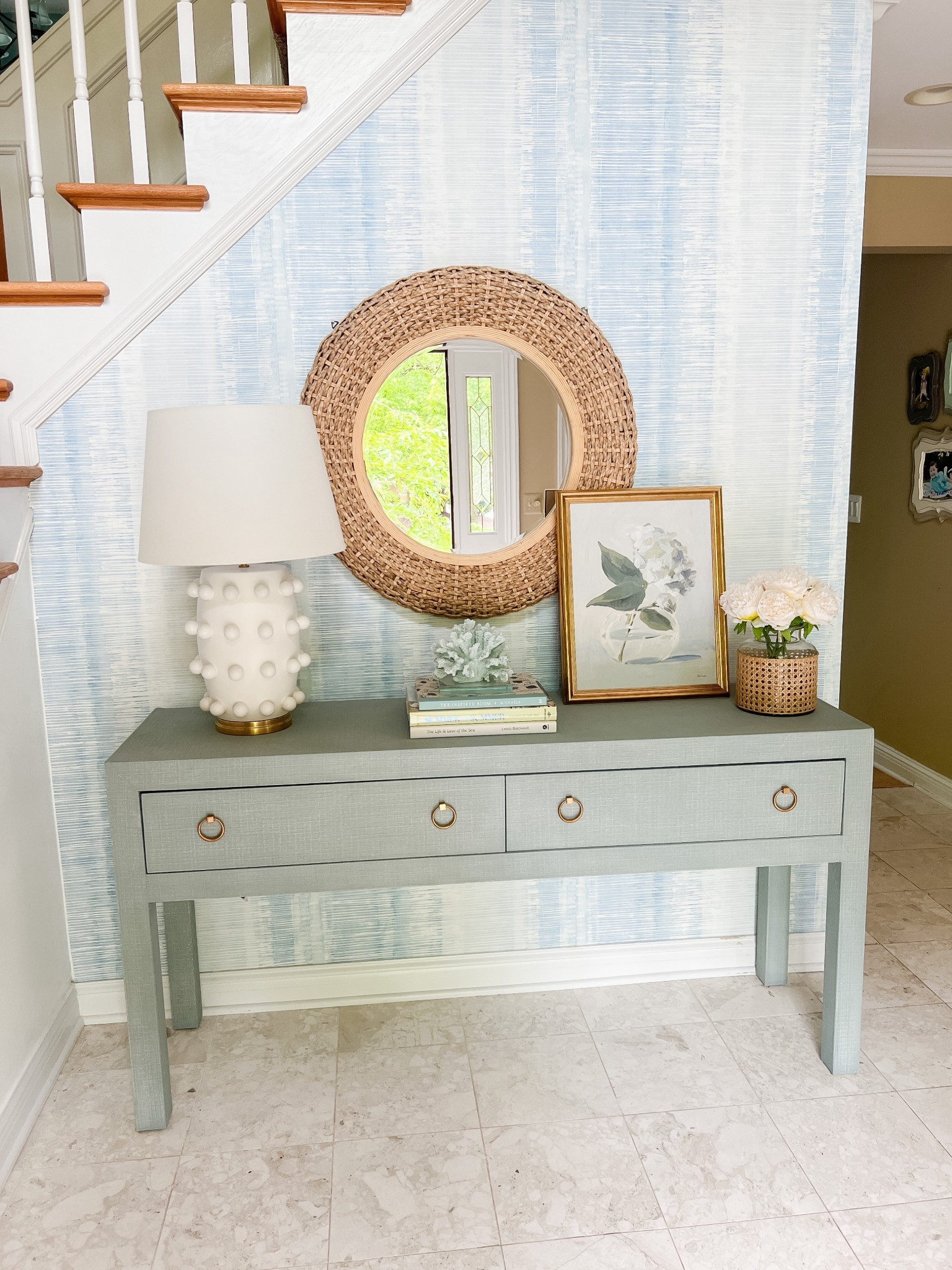 My foyer features a Serena & Lily linen console table, blue ikat wallpaper, and a designer-inspired white lamp for a classic modern coastal entryway look. I love how the blue and white palette makes this space feel bright, welcoming, and effortlessly coastal chic. 

#LTKSaleAlert #LTKU #LTKHome