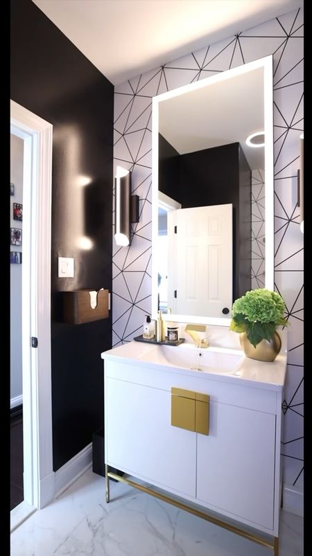 A MOODY Powder bathroom transformation with wallpaper and decorative accents #bathroomdecor #beforeandafter #wallpaper #bathroomtransformation #bathroomvanity

#LTKSaleAlert #LTKHome