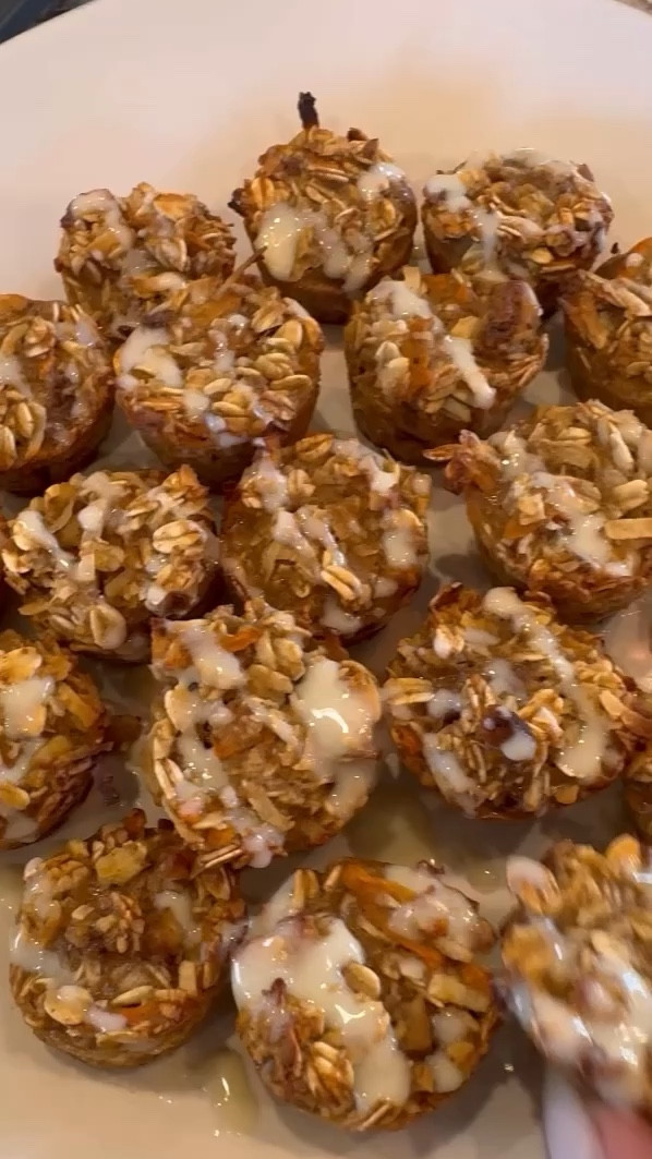 Carrot cake oat muffins 

Dry ingredients:
3 cups rolled oats
1tbsp ground cinnamon
1tsp baking powder
1/2 tsp salt
2/3 cup glazed or candied walnuts (chopped up)
2/3 cup shredded coconut 

Wet ingredients:
1 cup mashed ripe banana
1 cup shredded carrots
2/3 cup unsweetened applesauce 
3 eggs
1 cup milk
1/4 cup maple syrup 

Protein glaze:
1 scoop vanilla protein powder 
1-2 tbsp milk (or more depending how you want the consistency- start with 1tbsp, stir, and add from there) 


Preheat oven to 350 degrees.
Combine all of your wet ingredients in one bowl and all of your dry ingredients in another bowl- then mix them together and fill your lightly greased muffin pans. (I used one standard size 12 cup muffin pan and one 24 cup mini pan for this recipe. You can cut this recipe in half if you want less - or bake it in a large rectangle dish as an oatmeal bake) 
Bake for 20 min if using the muffin pans or 35-40 if using the large rectangle dish- or until you muffins appear golden around the edges with no excess moisture in the middle. 
When done baking, let them cool for a few minutes and then drizzle your protein glaze on top and enjoy! *I keep these on the fridge in an airtight container for a few days or once they are completely cooled you can freeze them*

#LTKbaby #LTKfamily #LTKfindsunder50