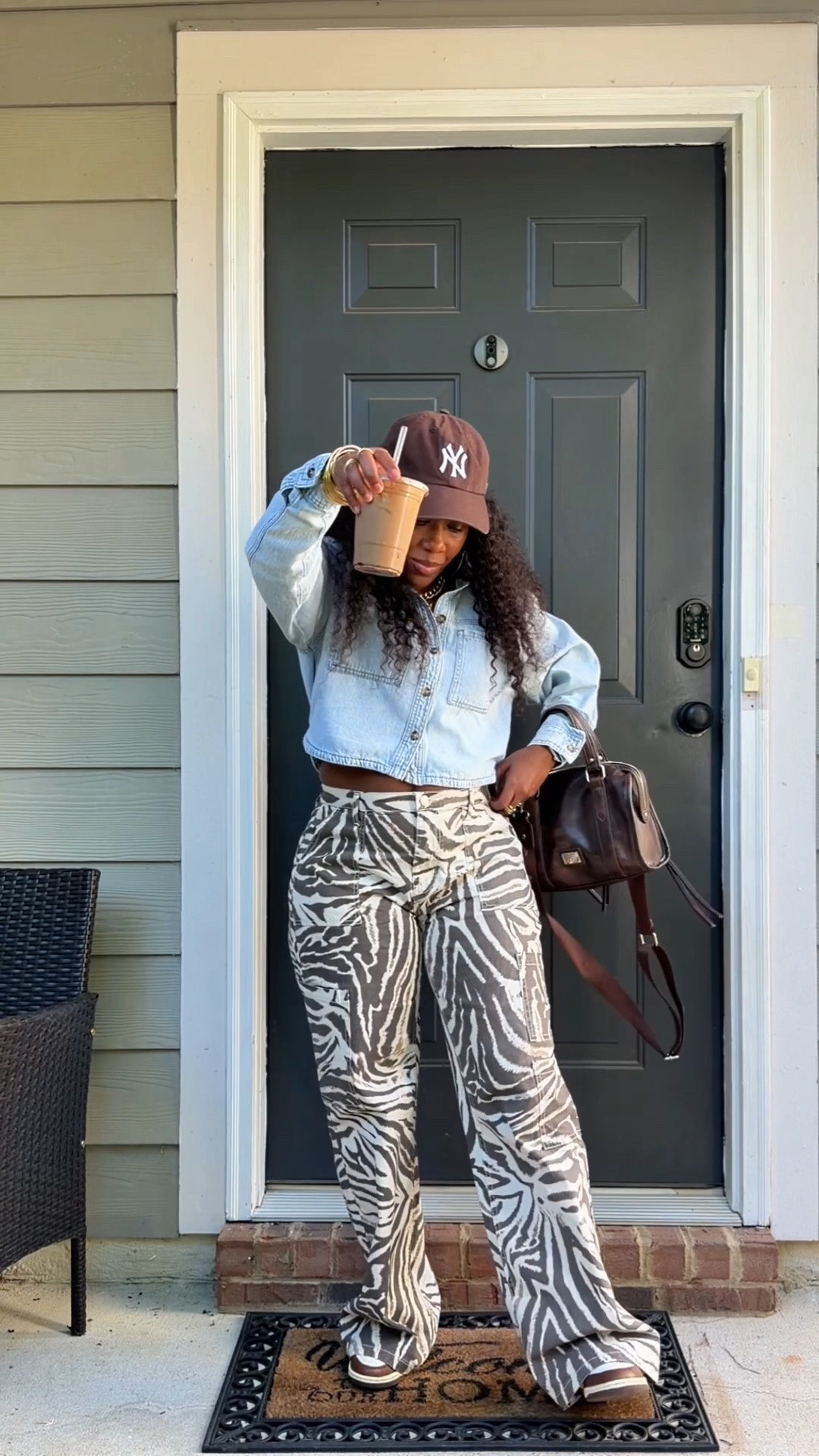 These zebra print wide leg pants are definitely the statement piece. I kept the rest of the outfit casual with a cropped denim shirt, brown baseball cap, brown bag and sneakers. I love an outfit that’s comfortable but still looks put together.
Everything I can link from this look is right here on LTK.

#LTKootd #LTKOver40 #LTKPetite