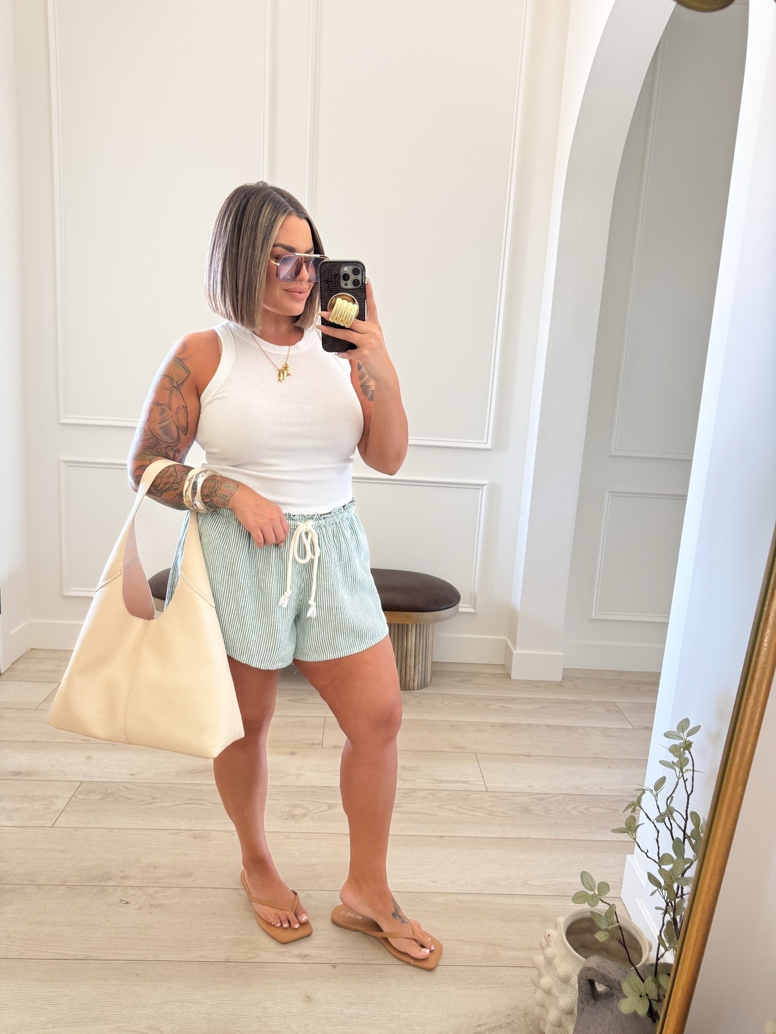 Tank M 
Shorts L 
Sandals size up 
Also linked my bra it is so comfy and straps cross in the back so they don’t show.