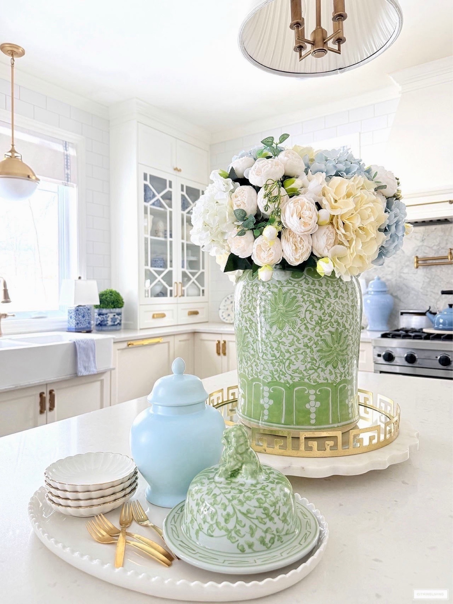 Chic spring kitchen details! Layer trays and accessories with an oversized floral arrangement in a gorgeous ginger jar for a stunning look!

#LTKSeasonal #LTKHome