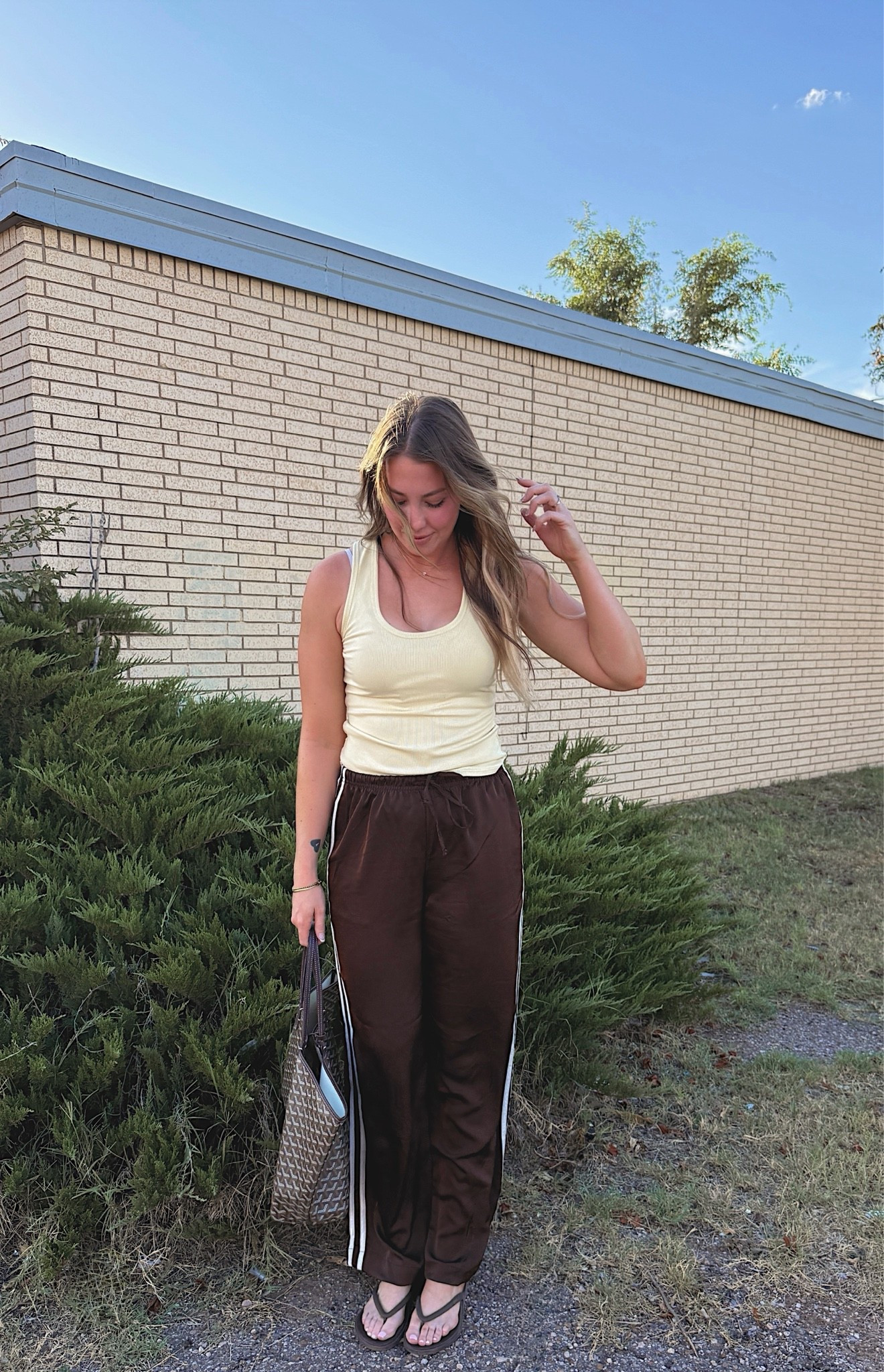 If you’re a rectangle body type, and you’re looking for some satin pants that are flattering and comfy - you need these! They come in short regular and tall inseam options!  I am 510 wearing a small tall and satin track pants and a small in butter yellow tank top ￼