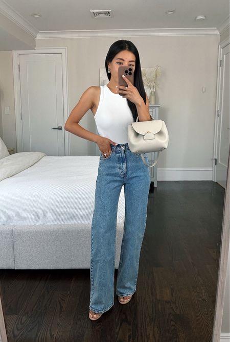 •90s relaxed jeans - size 24 short has a 24” waist and a 28.5” inseam that I’m wearing here with 3” heels (I’m 5ft tall) If you are similar to me in height and want to wear these with lower shoes or flats, I’d do the Extra Short! The denim is a more rigid style, vintage inspired jean with minimal stretch.

The wash is called medium marble, but I got mine last year so the color may have changed

 •AF bodysuit xs 

•Polene bag (not linkable)

#LTKSeasonal #LTKSpringSale #LTKsalealert