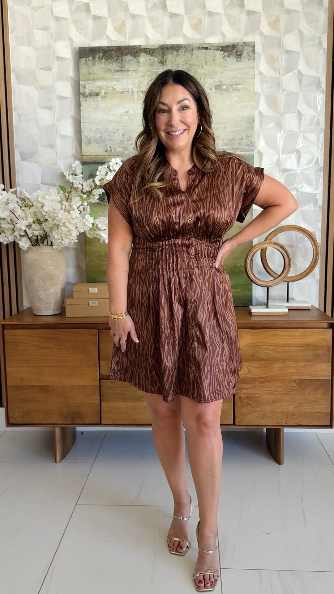 @anthropologie Satin mini dress moment ✨ Brown zebra-print satin short-sleeve shirt dress with a smocked waist, styled with a gold pleated clutch and metallic gold ankle-strap heels. A chic date-night and cocktail dress in rich fall brown tones.

Sizing: true to size, large

#LTKSeasonal #LTKOver40 #LTKMidsize