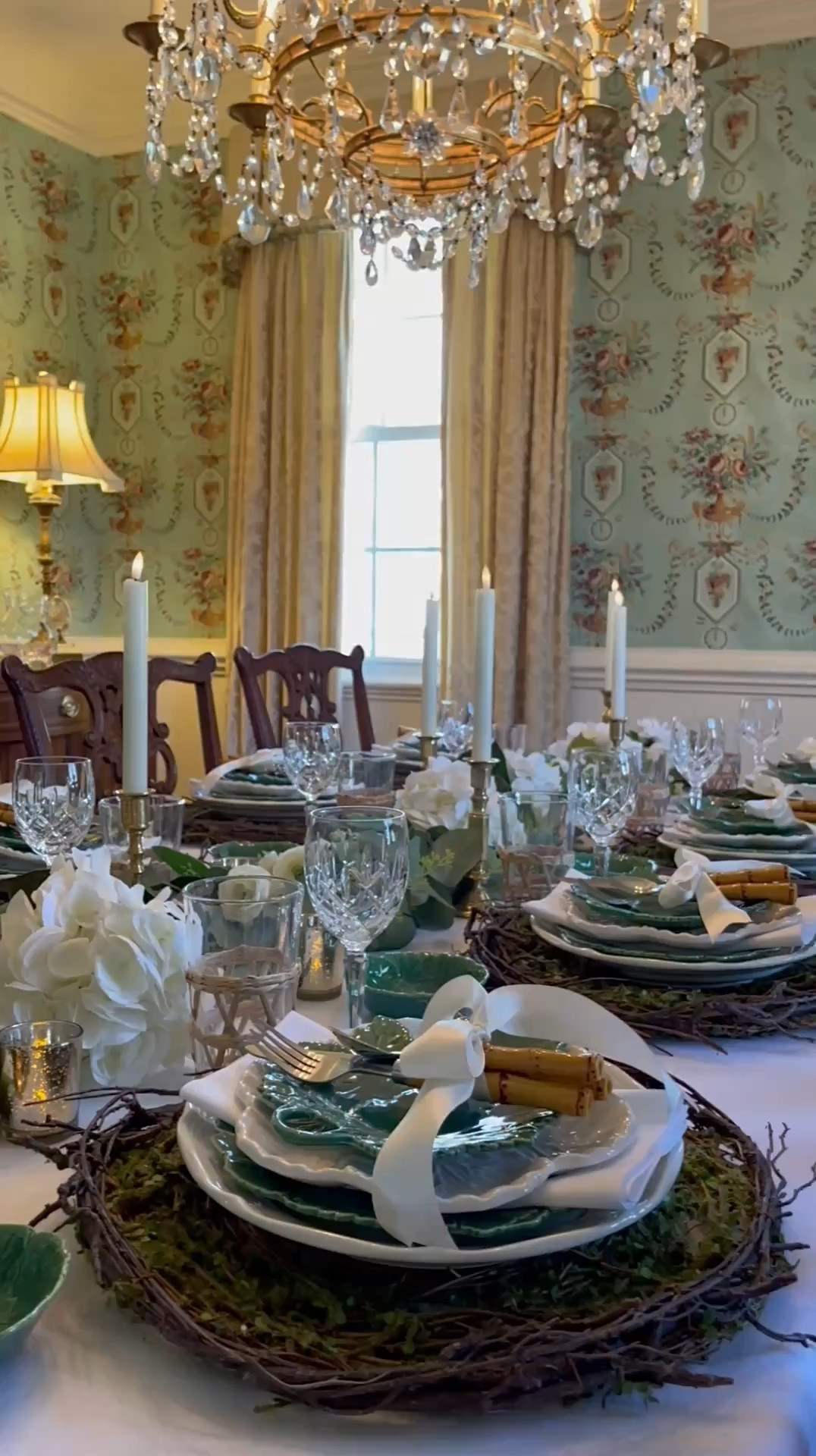 A tablescape that welcomes Spring! ✨ Today, I’m taking a little walk down memory lane, revisiting a table setting that effortlessly bridges the seasons from winter to spring. This setup feels like something straight out of a storybook—lush greenery, crisp whites, and hints of gold capturing the magic of spring’s arrival.

Picture yourself sitting down to a charming place setting: copper mugs gleaming beside a layered stack of plates, starting with rustic grapevine chargers, followed by delicate white and green cabbage plates, and finished with bamboo cutlery tied with ivory satin ribbons. At the heart of the table, a breathtaking eucalyptus garland weaves through soft white roses and hydrangeas, all aglow in the warm flicker of candlelight.

Whether you’re planning for Mother’s Day, a St. Patrick’s Day gathering, or an intimate book or garden club soirée, I hope this inspires your next celebration. What occasion would you use this tablescape for? Let me know below! Cheers to making every moment feel special! 💚

#LTKSeasonal #LTKHome #LTKParties