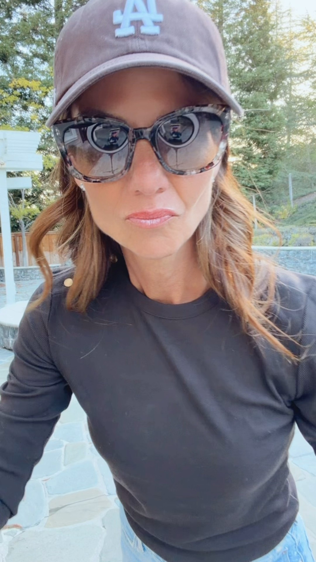 Today's look is a long sleeve crewneck with buttons on the shoulder, currently on sale. Styled with a slight barrel jean that fits true to size.  Added a puffer jacket and baseball cap. Both available in multiple colors. And finish the look with chocolate brown suede, ballet flats, and bag, all in sale  Can't forget my stylish sunglasses.

#LTKSaleAlert #LTKFindsUnder50 #LTKgrwm