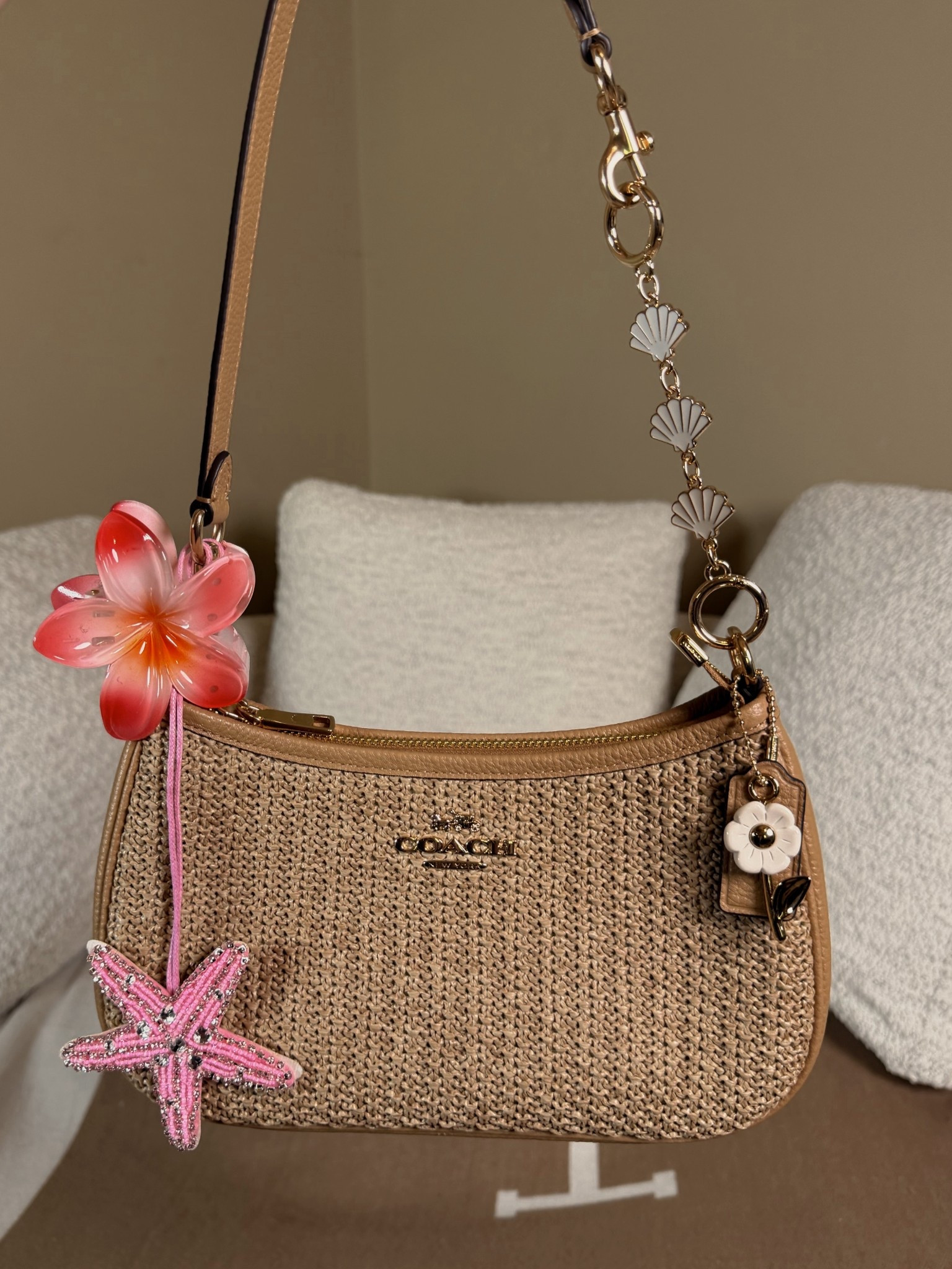 Getting my raffia Teri summer ready 
Tropical flower claw clips
Beaded starfish bag charm
Seashell strap extender
Coach outlet 