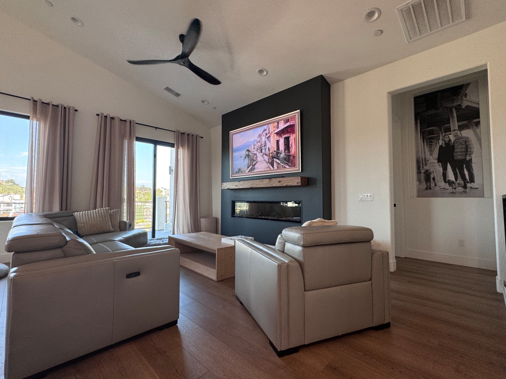 Family room | living room | open concept | art tv | couch | recliner | sectional | black wood fan | wood mantle | electric fireplace 

#LTKdayinmylife #LTKU #LTKHome