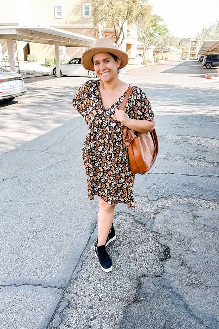 Black babydoll floral dress with wedge sneakers, a faux leather handbag, and fedoraa

#LTKmidsize #LTKshoecrush #LTKfindsunder50