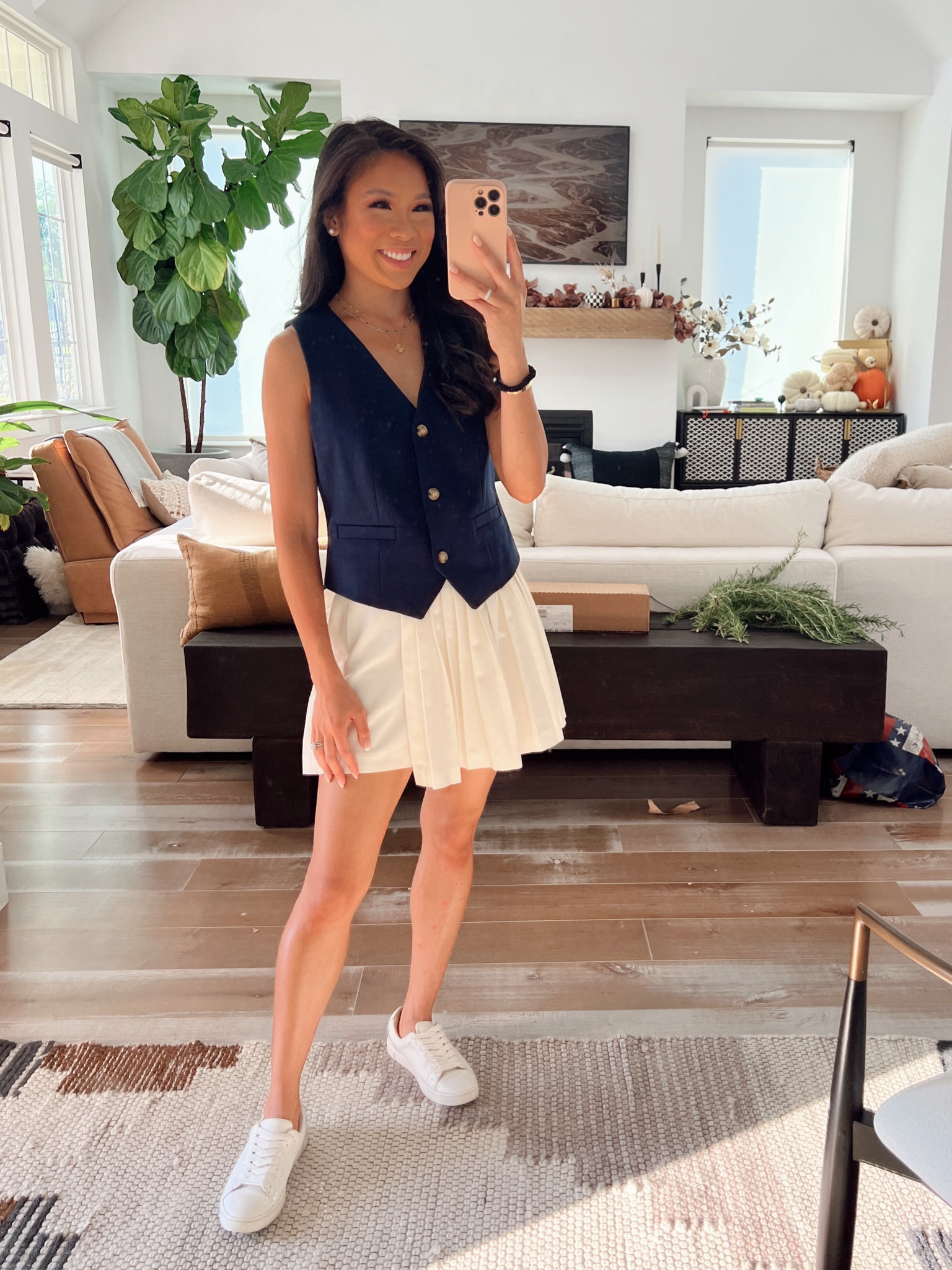 Transitional fall outfit with a navy vest and pleated skort. Perfect for the Dallas Cowboys game with leather sneakers  

#LTKSeasonal