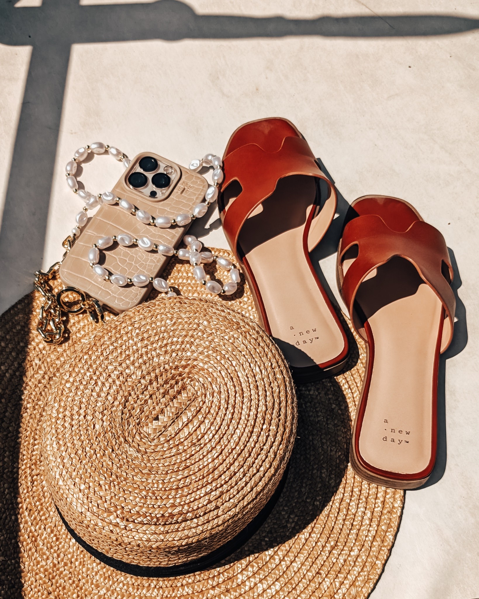 Lux old money summer aesthetics - in my rich girl era! Step out for a relaxing day on the water with this straw boat hat, cute slip-on sandals, and lux pearl phone strap

Straw hat / sandals / slip-ons / phone case / sad beige / pearls / old money / beach ready / boat hat / yacht vibes 

#LTKShoeCrush #LTKSeasonal #LTKSummerEdit