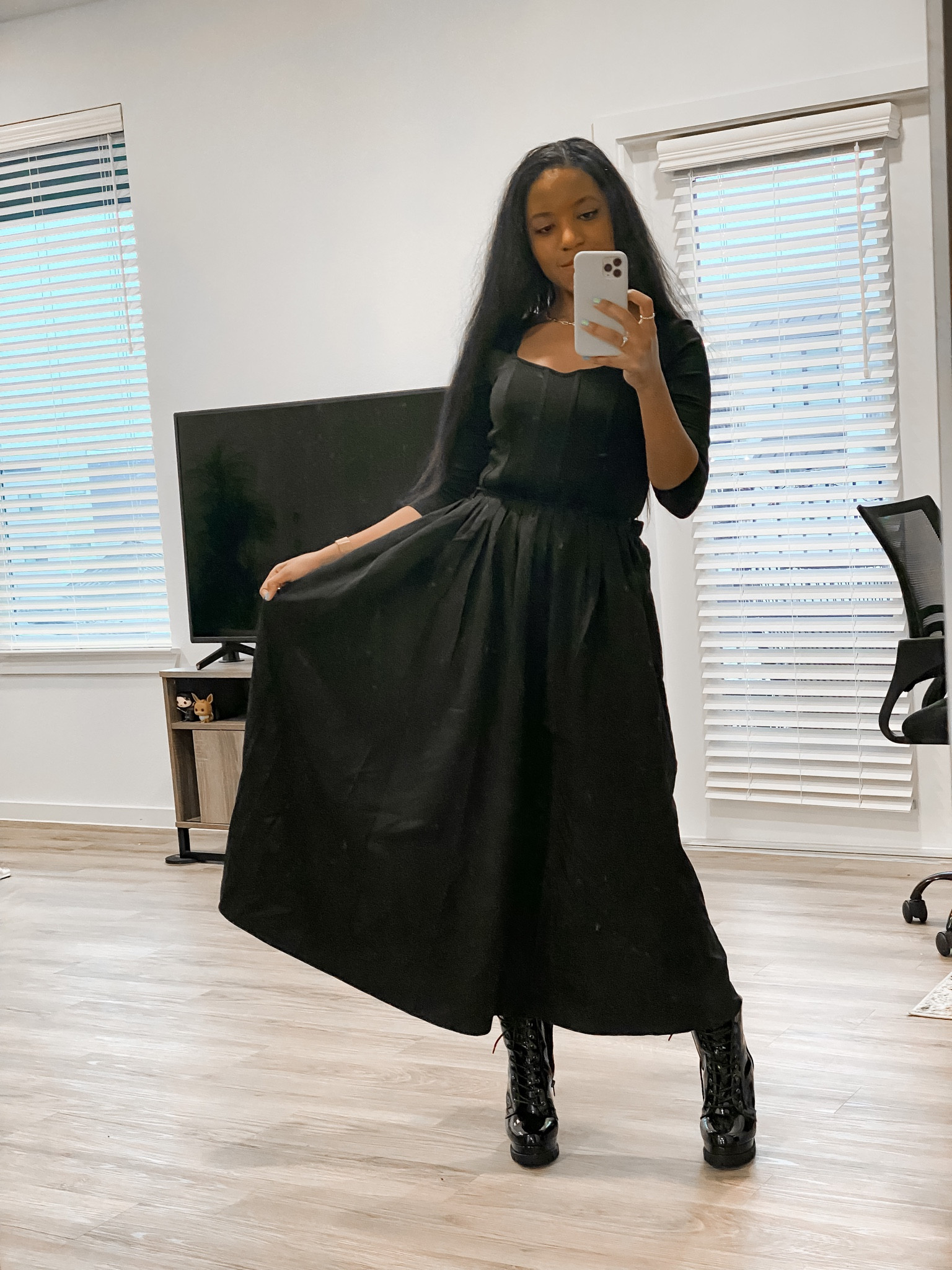 Valentine’s Day doesn’t have to be limited to red and pink. Flirty silhouettes can be worn in any color. I paired a black midi skirt with a black corset-like top to keep the outfit seamless. I’m wearing chunky boots for a trendier work outfit, but swap them for strappy heels to create a romantic date night look. 

#LTKworkwear #LTKstyletip #LTKSeasonal