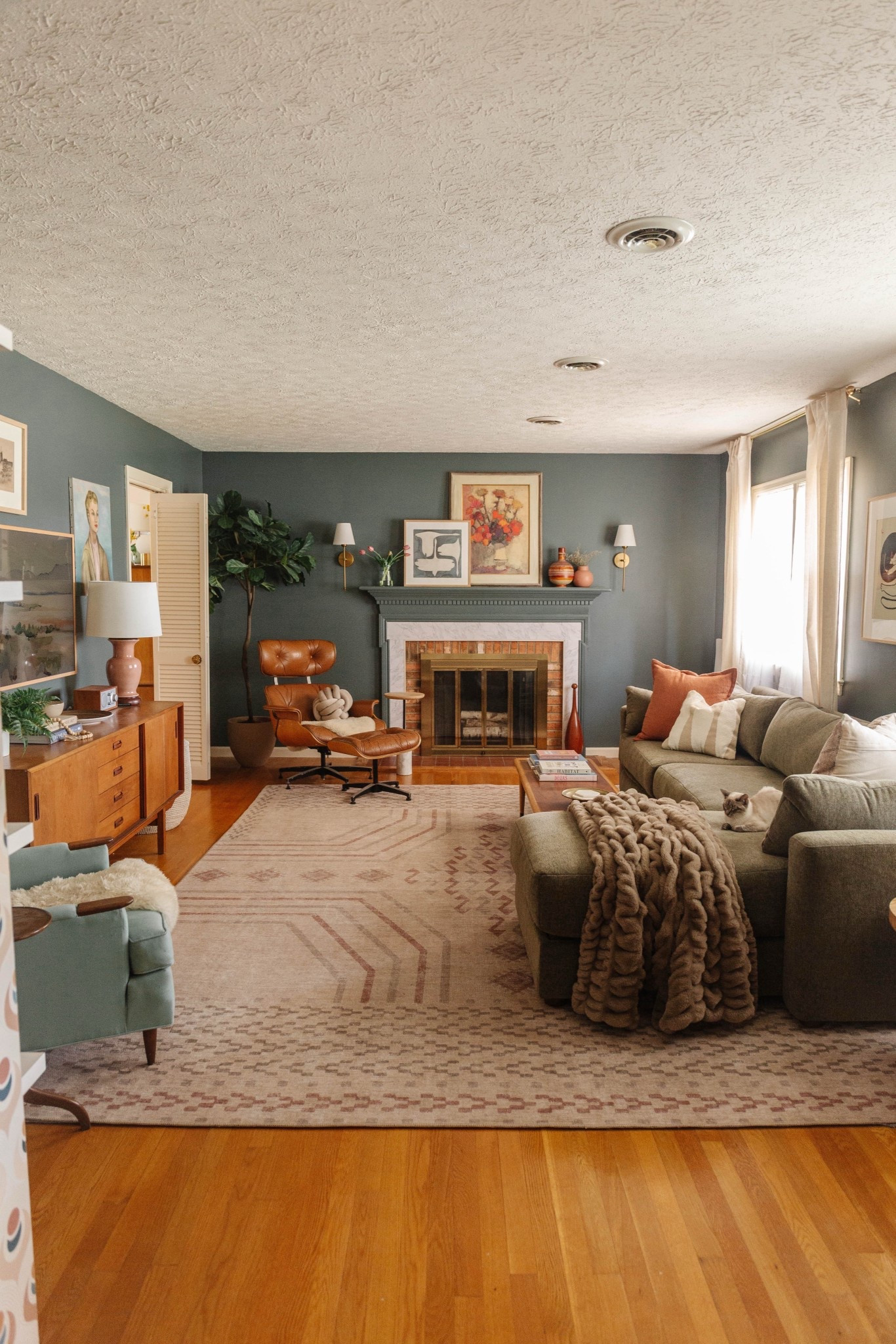 Get the look of our moody formal living room here! Paint color: Homburg Gray from Sherwin-Williams ⭐️

#LTKHome