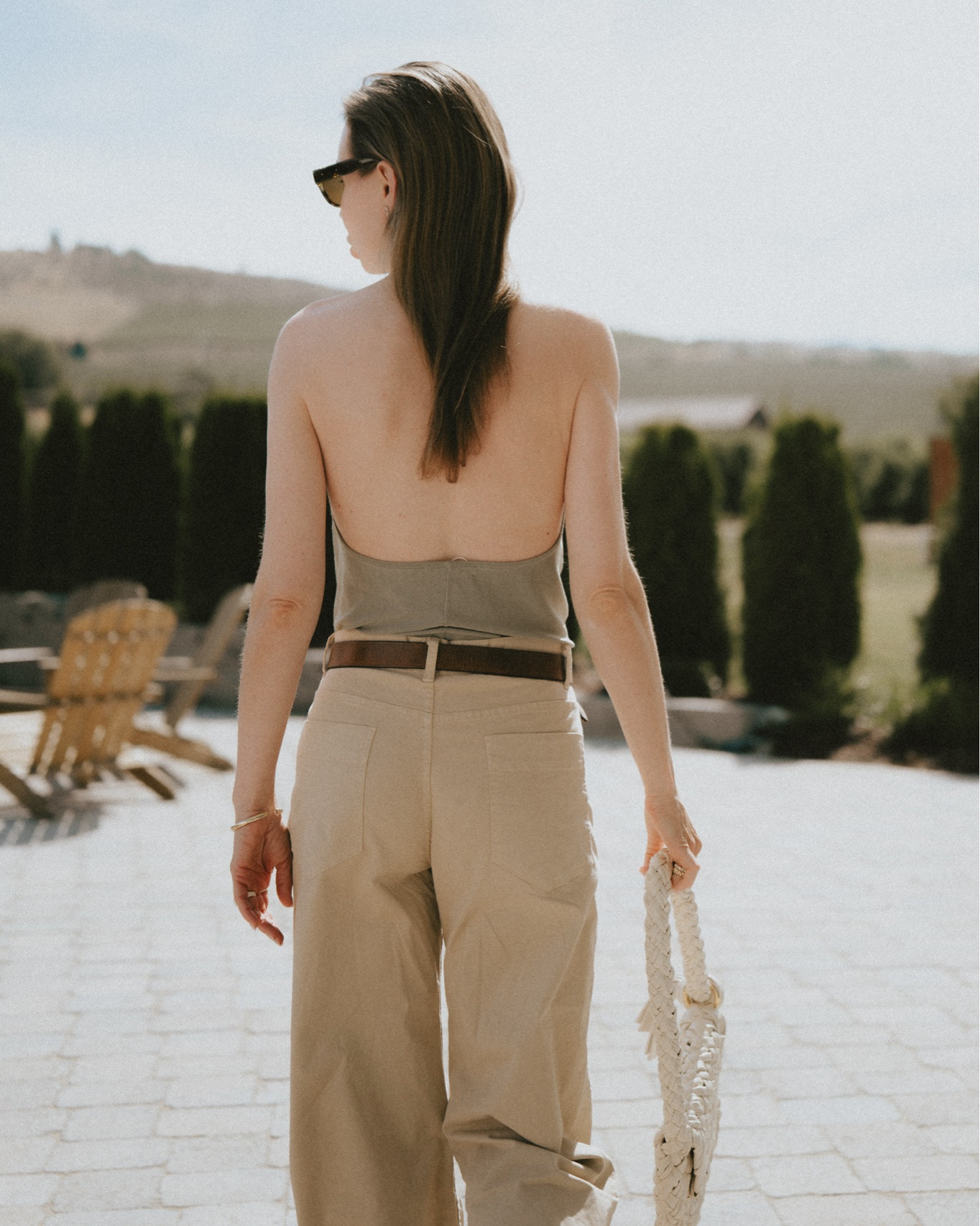 Halter top + barrel leg jeans + flip flops + woven shoulder bag. 
Top @OAK + FORT 
Pants: Nili Lotan Tribeca.
Bag: Bottega Veneta Kalimero Citta
Sandals: K. Jacques St. Tropez

#LTKootd #LTKTravel #LTKSeasonal