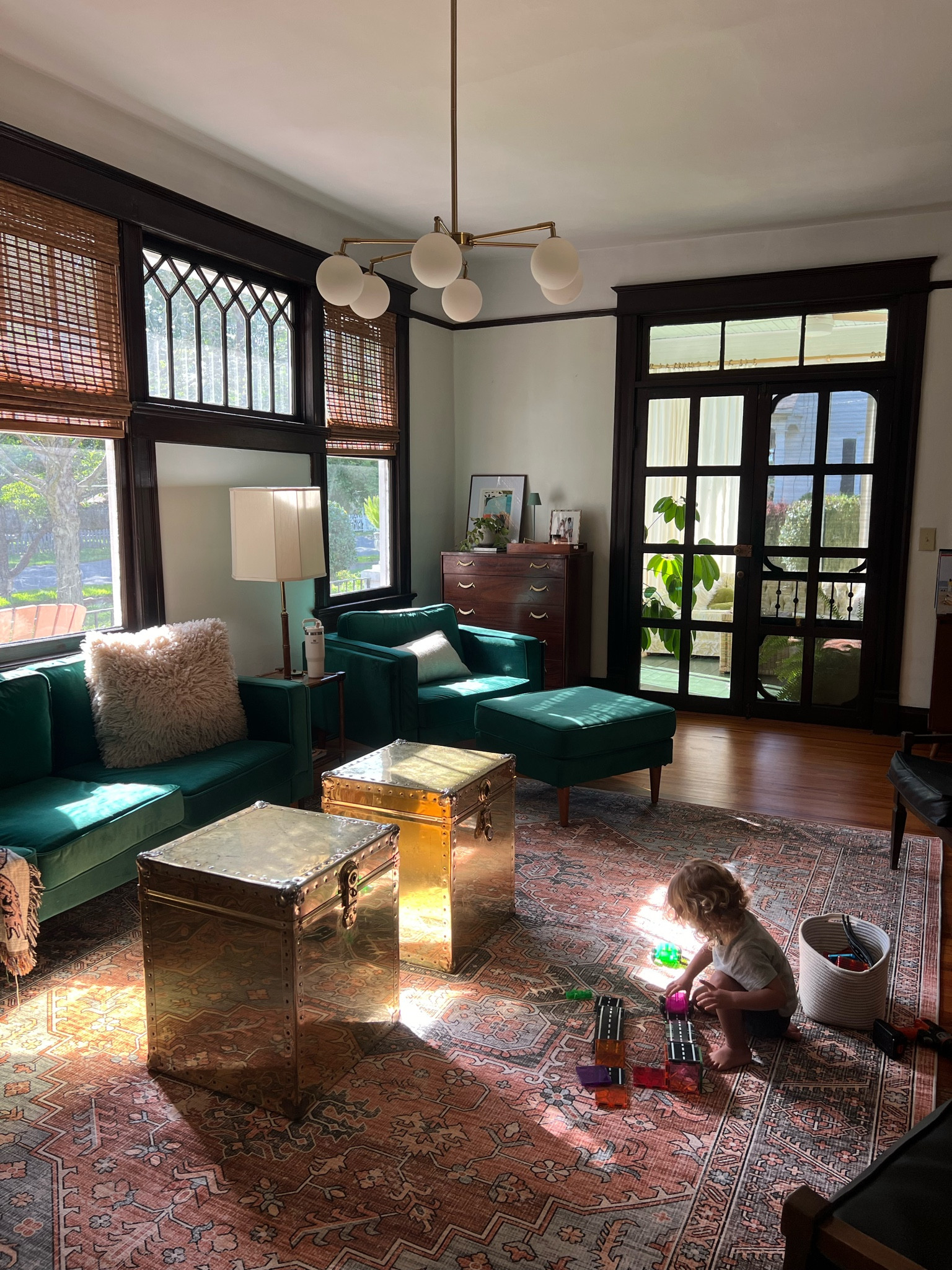 New rug! 

MCM home. Old home. Vintage home. Rug green sofa. Green couch. Colorful home. Gold trunks  

#LTKHome #LTKSeasonal #LTKFamily