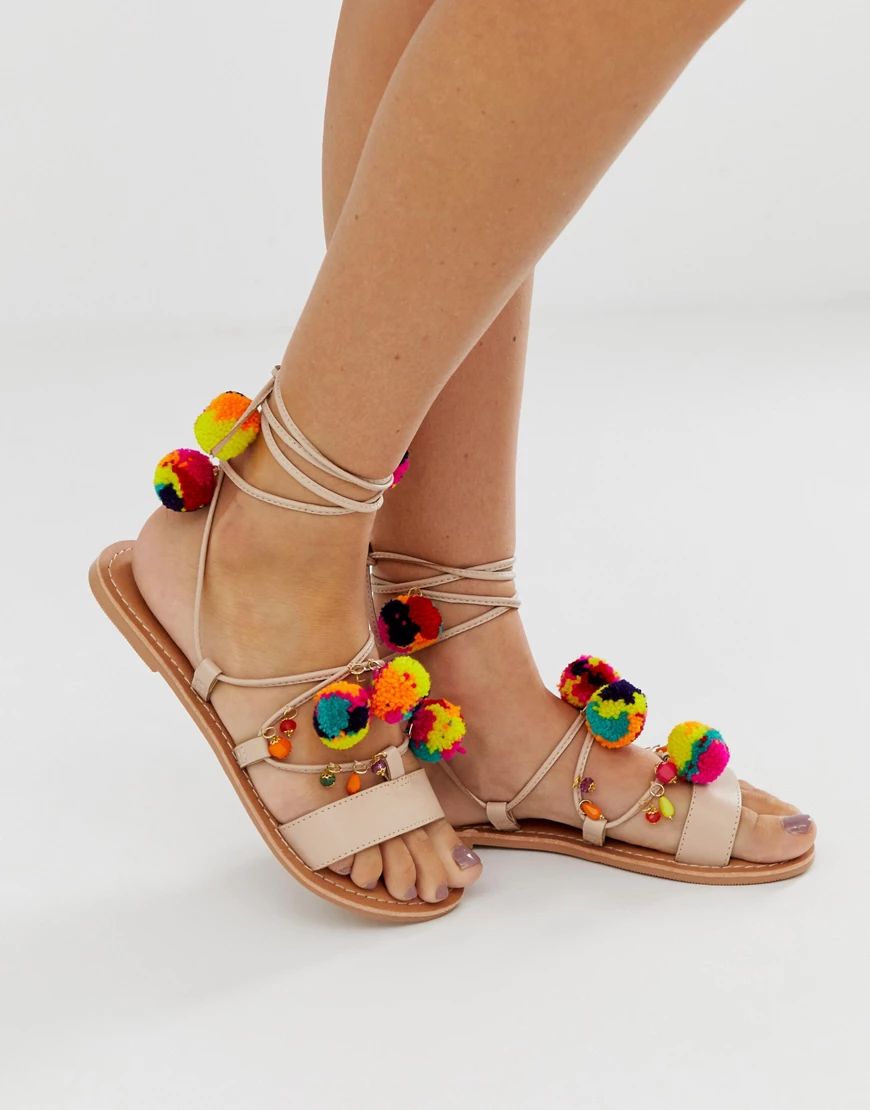 ASOS DESIGN Fun Fair pom pom leather tie leg flat sandals-Beige | ASOS (Global)