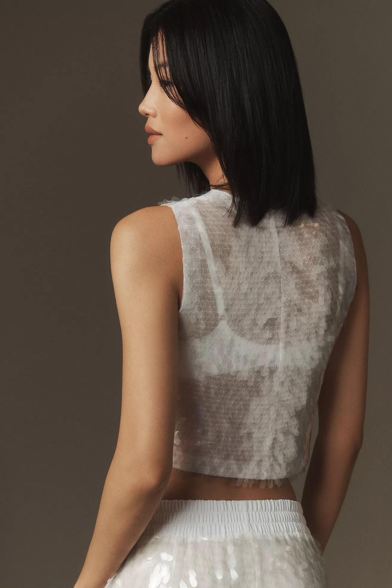 Norma Kamali Sleeveless Sequin Cropped TopNorma KamaliWrite a Review Reviews$255.00Color: WHITEFi... | Anthropologie (US)