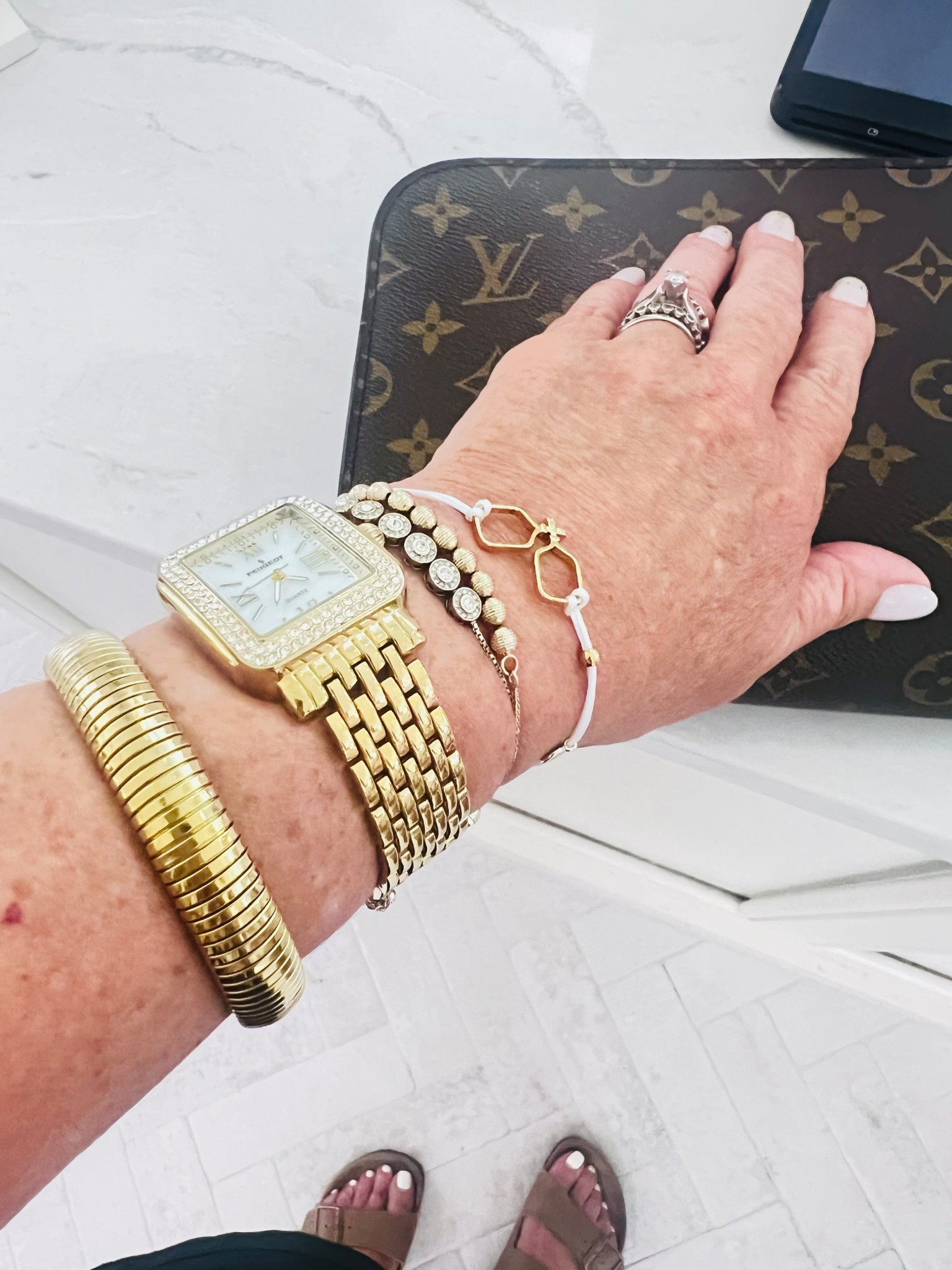 Arm candy...great watch, gold bead bracelet, amazon bangle, pickle ball string bracelet .

#LTKStyleTip #LTKTravel #LTKFindsUnder50