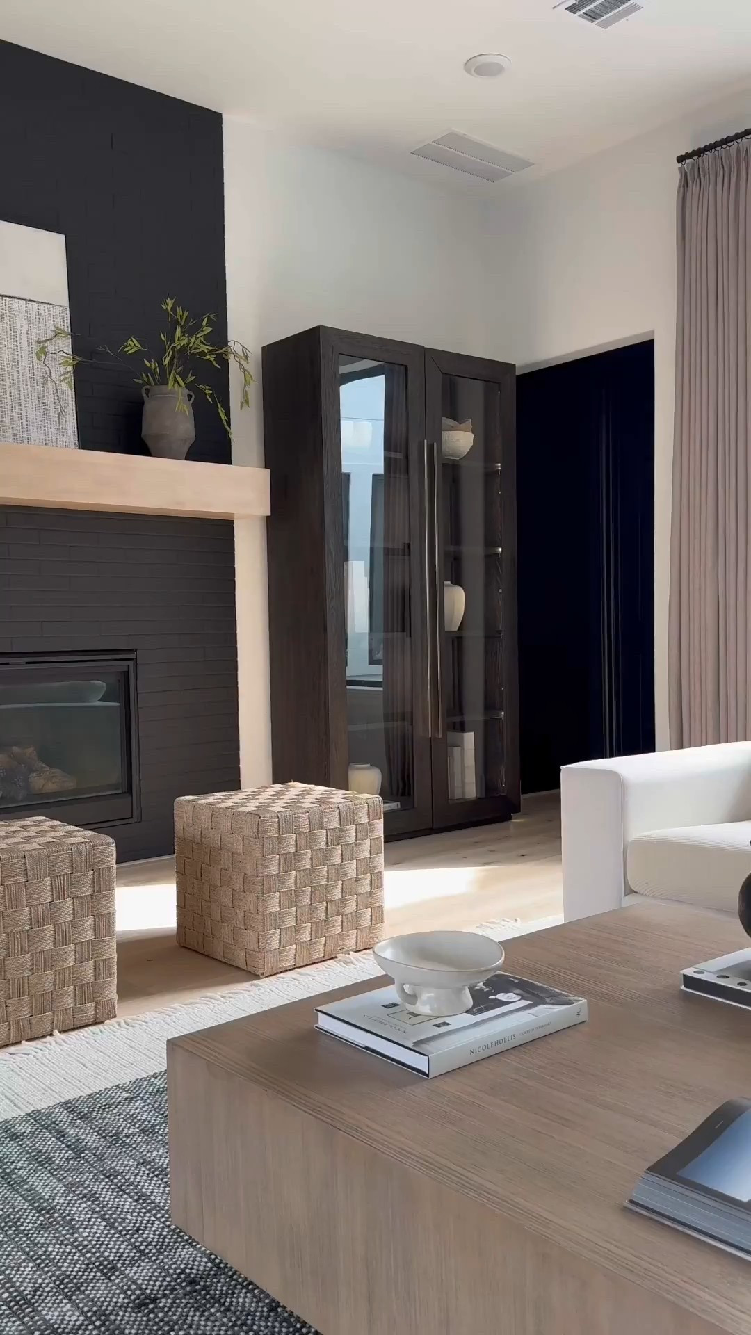 Add a stylish accent to your home with this Lynwood Checkerboard Woven Cube. This cube showcases a woven design with a checkered pattern, adding a distinctive accent to your space. Ideal for resting your feet or storing towels and throws, this natural shade cube is a versatile and functional addition to any room in your home. 

I’ve linked other items below 😁 including my drapes.🤍

#LTKSaleAlert #LTKStyleTip #LTKHome