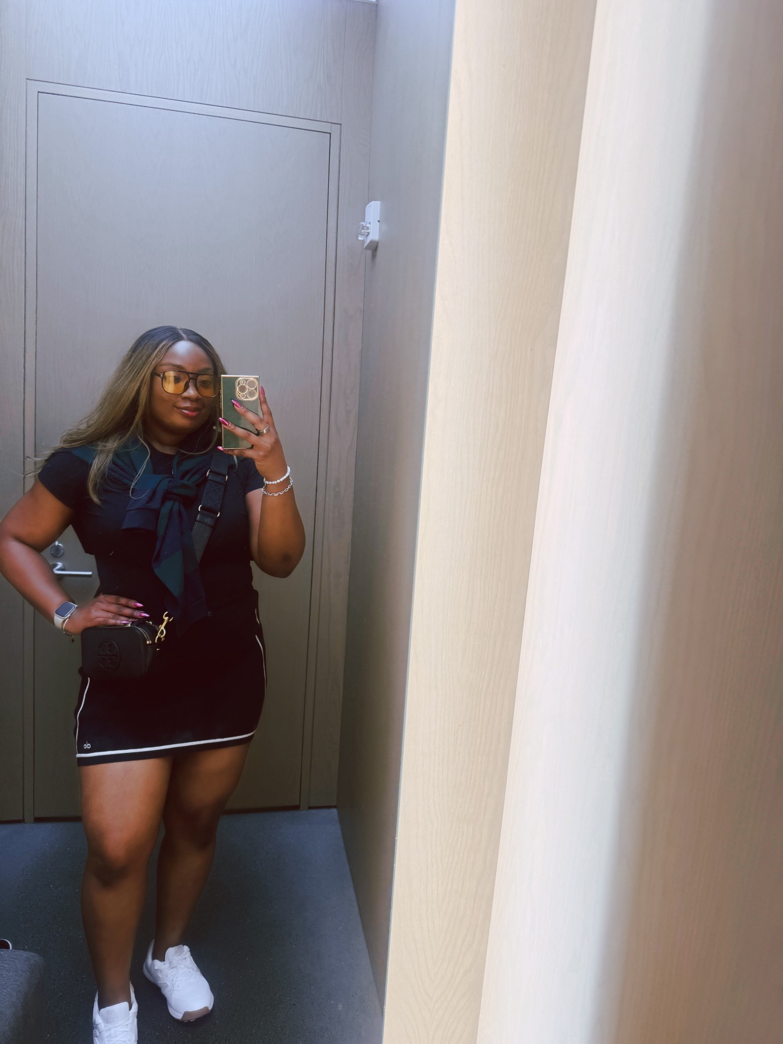 ✨ Fit of the Day ✨

When sporty meets chic 🤍 This mini moment is all about keeping it sleek but still comfortable enough to move through the day.
	•	Wearing the Alo Yoga ribbed sweater knit mini skirt — love the stripe detail, it instantly makes the outfit pop.
	•	Draped the Gold Hinge striped rugby long sleeve over my shoulders for that effortless preppy vibe.

Finished it off with my go-to crossbody and clean white sneakers. 🖤

Would you wear this look for errands, brunch, or travel days?


sporty chic outfit, casual chic style, alo yoga outfit, preppy casual look, travel outfit idea, brunch outfit inspo, black mini skirt outfit

#LTKStyleTip #LTKMidsize #LTKNYFW