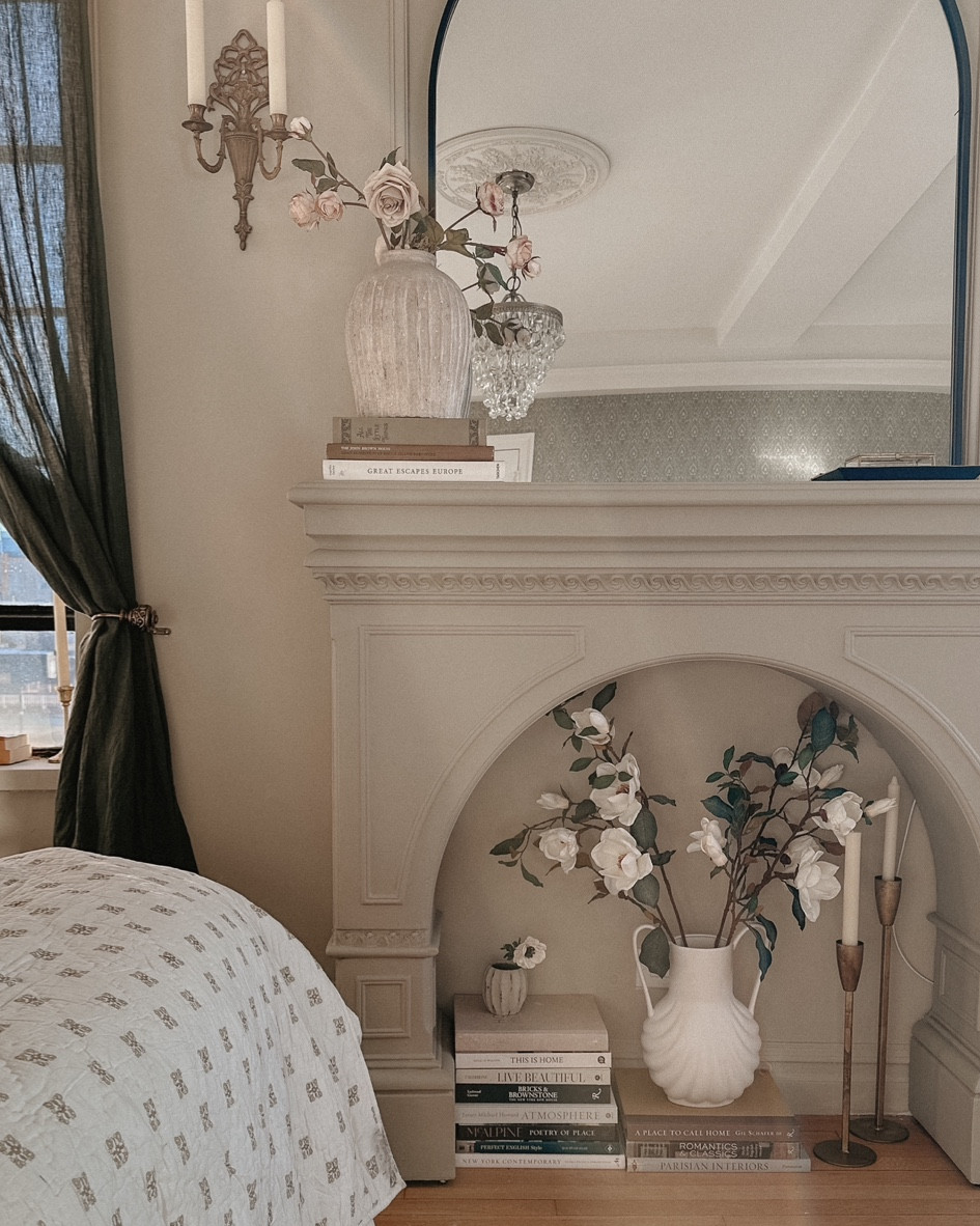 Vase with faux magnolia branches 