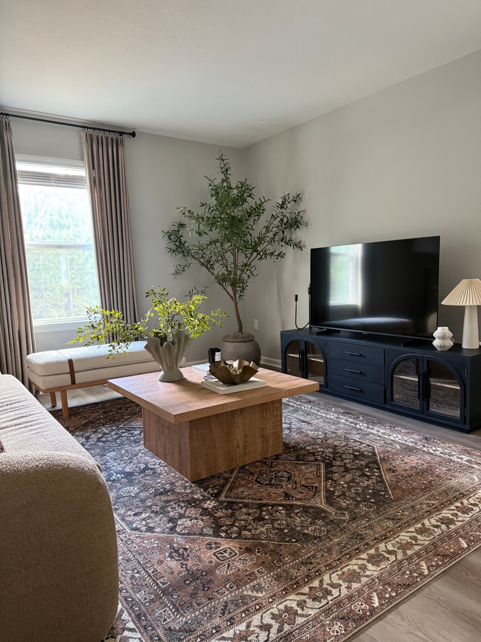 My designer inspired tv stand is back in stock and ON SALE!! Not to mention my coffee table is also on flash deal! 🙌🏽 

Designer inspired home finds, black tv stand, wood coffee table, living room inspo, moody rug, neutral home decor 

#LTKSaleAlert #LTKSeasonal #LTKHome